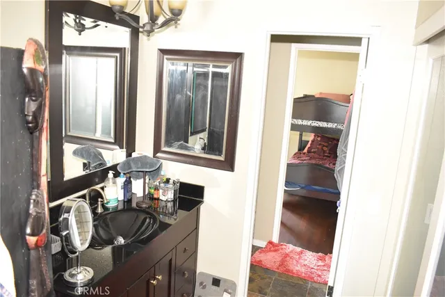 a bathroom with a sink and a mirror