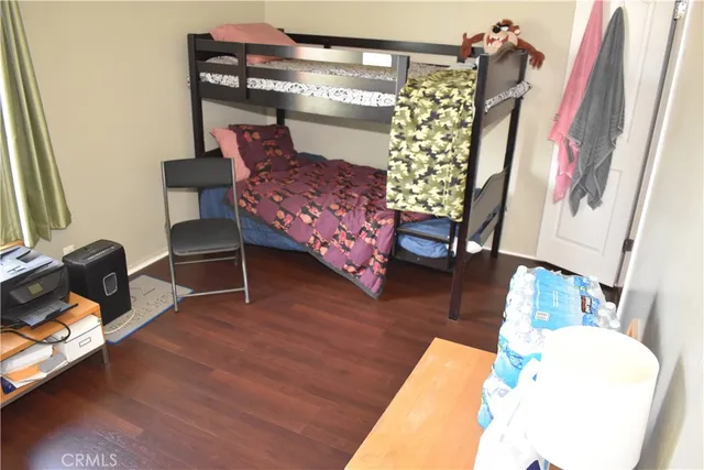 a bedroom with a bed and a chair