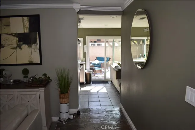 a hallway with a view of living room