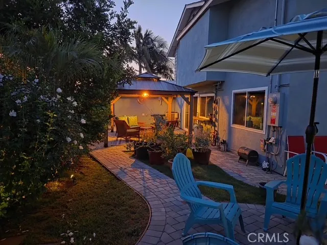 a view of a chairs and table in the patio