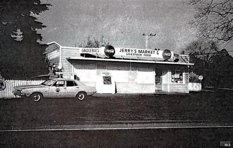 a view of a house with car parked