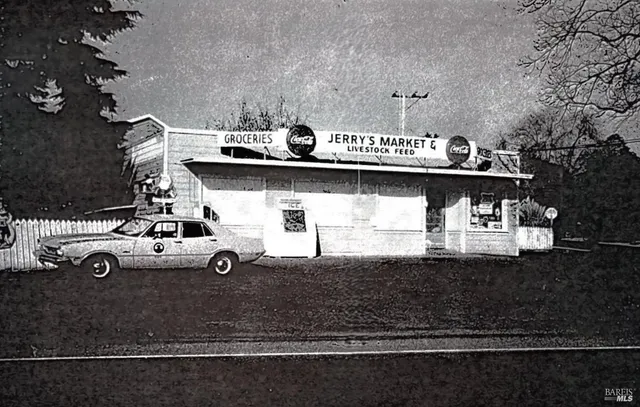 a view of a house with car parked