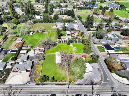 a view of backyard with sitting area