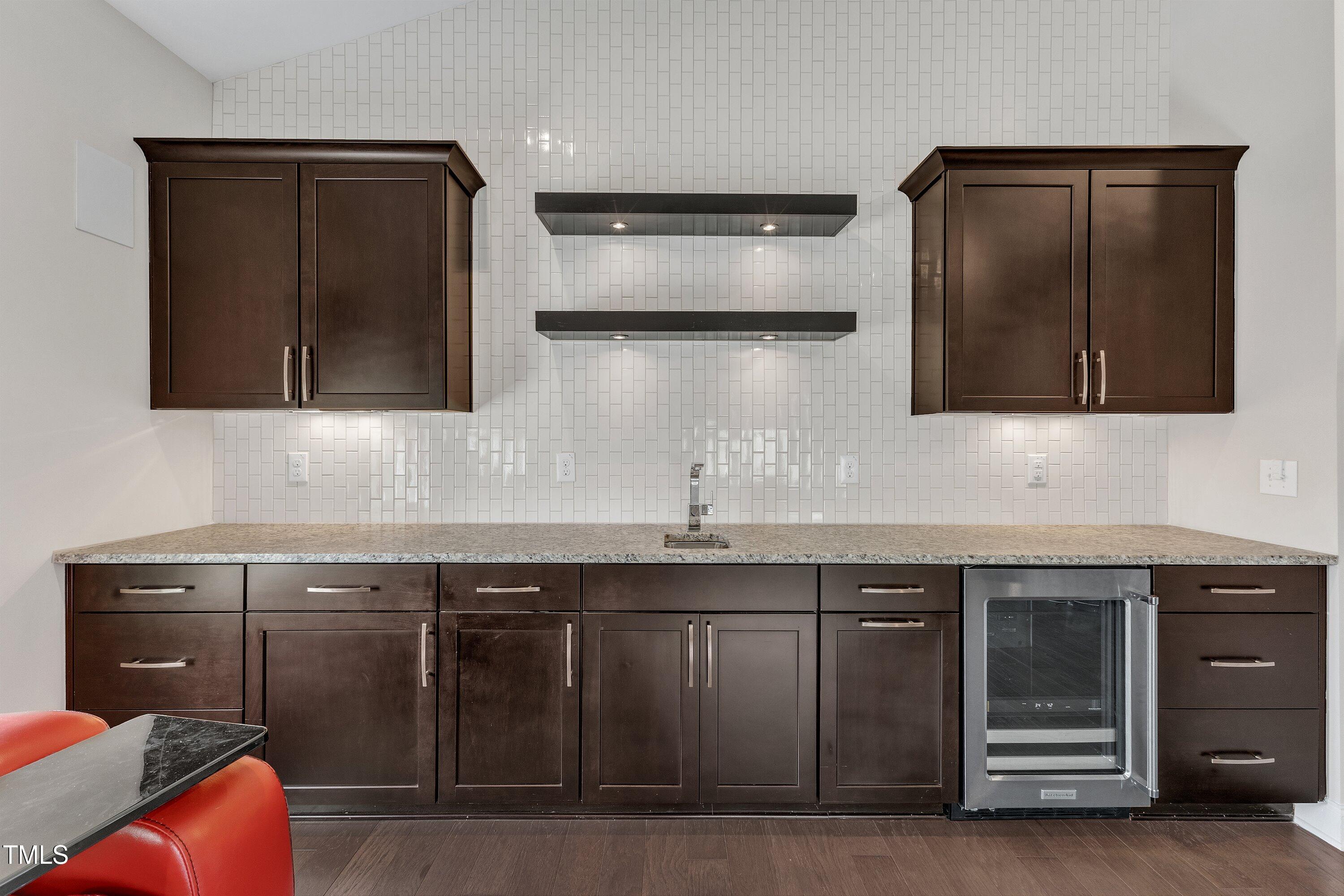8121 Greys Landing Way Raleigh, NC 27615 - Photo 42 of 95 a kitchen with stainless steel appliances granite countertop a sink and a microwave