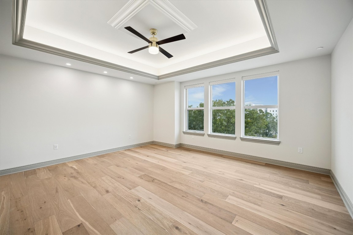 1717 Bissonnet Street, Unit 1802 Houston, TX 77005 - Photo 16 of 46 a view of an empty room with wooden floor and a window