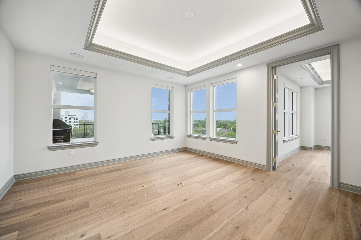 1717 Bissonnet Street, Unit 1802 Houston, TX 77005 - Photo 25 of 46 a view of an empty room with wooden floor and a window