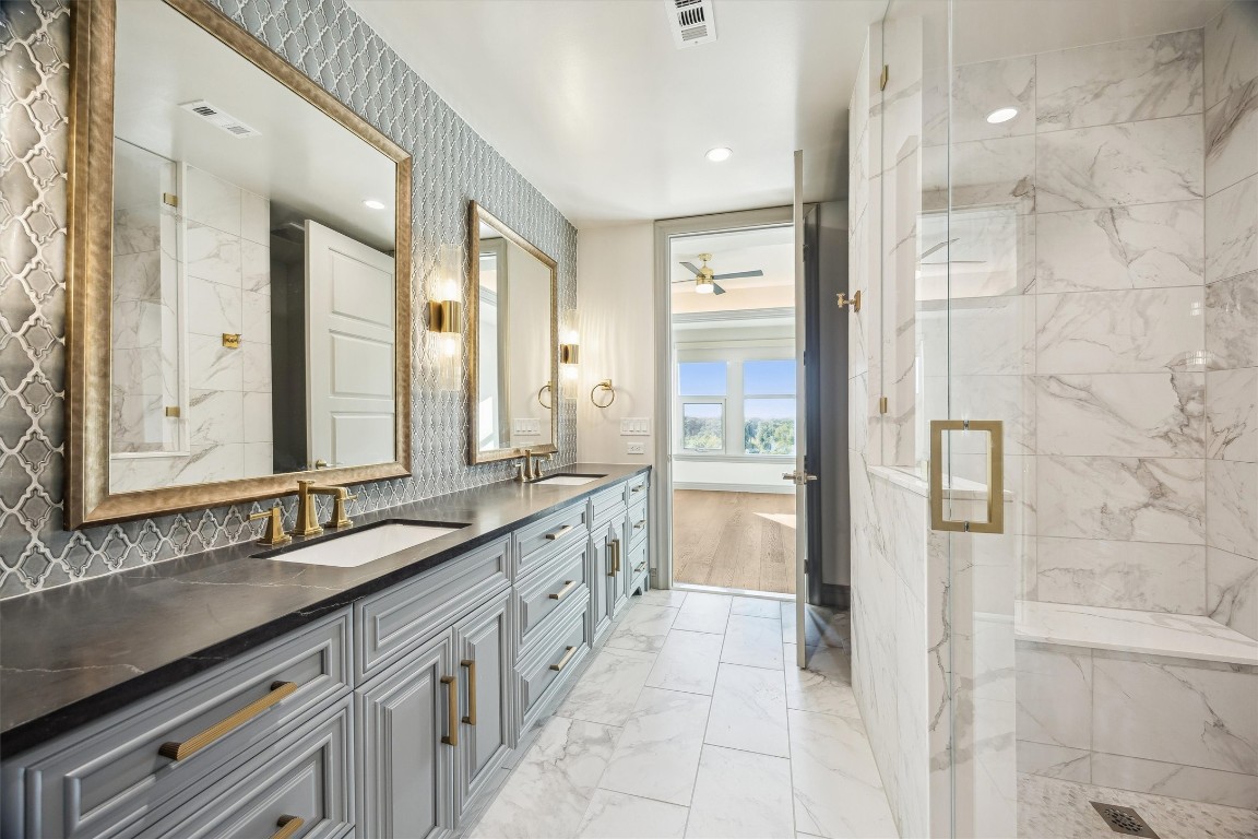1717 Bissonnet Street, Unit 1802 Houston, TX 77005 - Photo 29 of 46 Third bathroom with double sinks and an oversized shower.