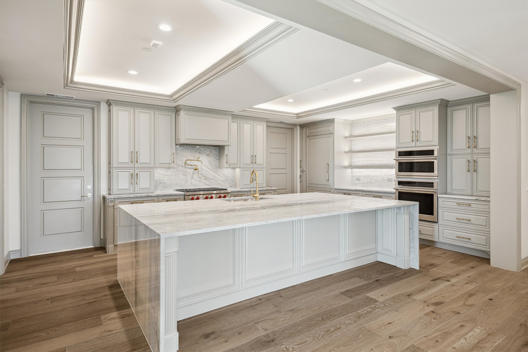 1717 Bissonnet Street, Unit 1802 Houston, TX 77005 - Photo 4 of 35 a kitchen with stainless steel appliances a stove and cabinets