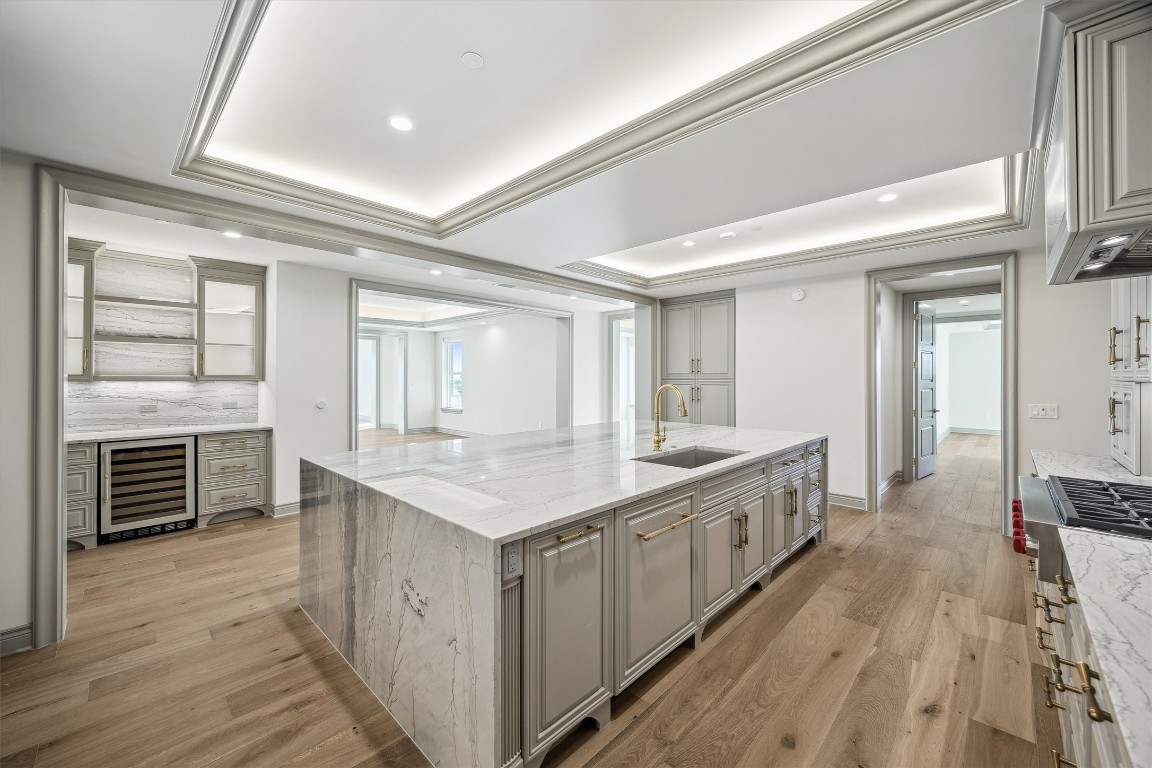 1717 Bissonnet Street, Unit 1802 Houston, TX 77005 - Photo 5 of 46 Panel front wine cooler, open shelving and glass front cabinetry.