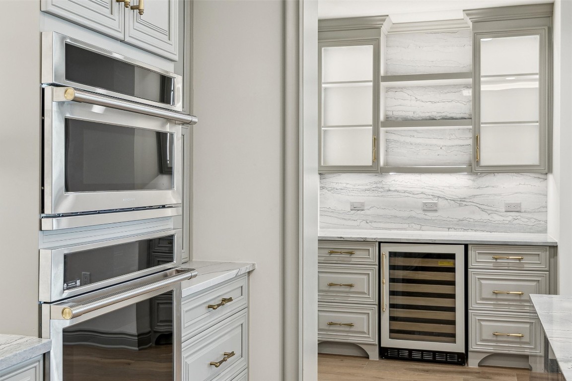 1717 Bissonnet Street, Unit 1802 Houston, TX 77005 - Photo 8 of 46 GE Monogram and Wolf appliances, custom cabinetry and brass hardware.