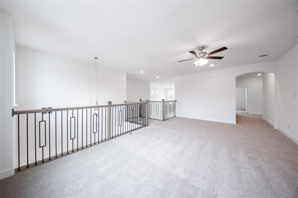 3807 Majesty Court Forney, TX 75126 - Photo 18 of 37 a view of a livingroom with a ceiling fan