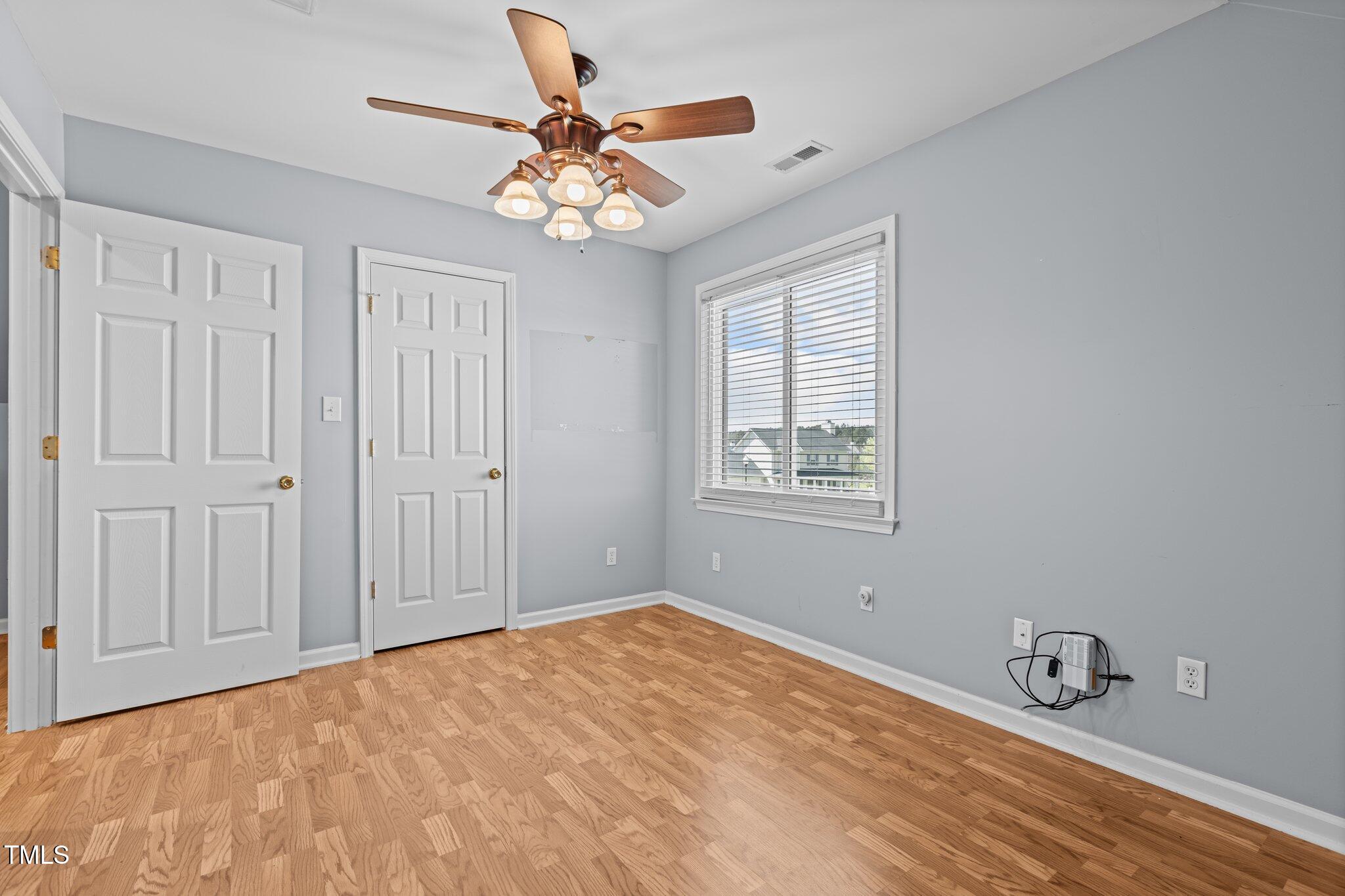 1408 Harvey Johnson Road Raleigh, NC 27603 - Photo 33 of 48 a view of a livingroom with a chandelier fan
