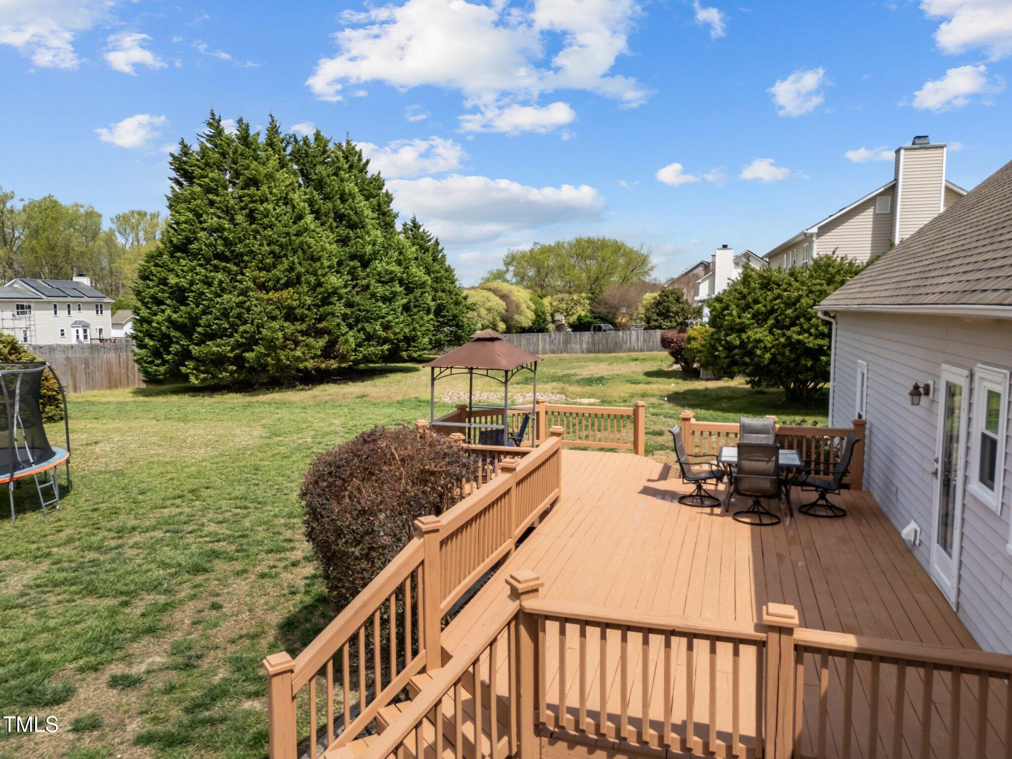 1408 Harvey Johnson Road Raleigh, NC 27603 - Photo 38 of 48 a view of a garden with sitting area