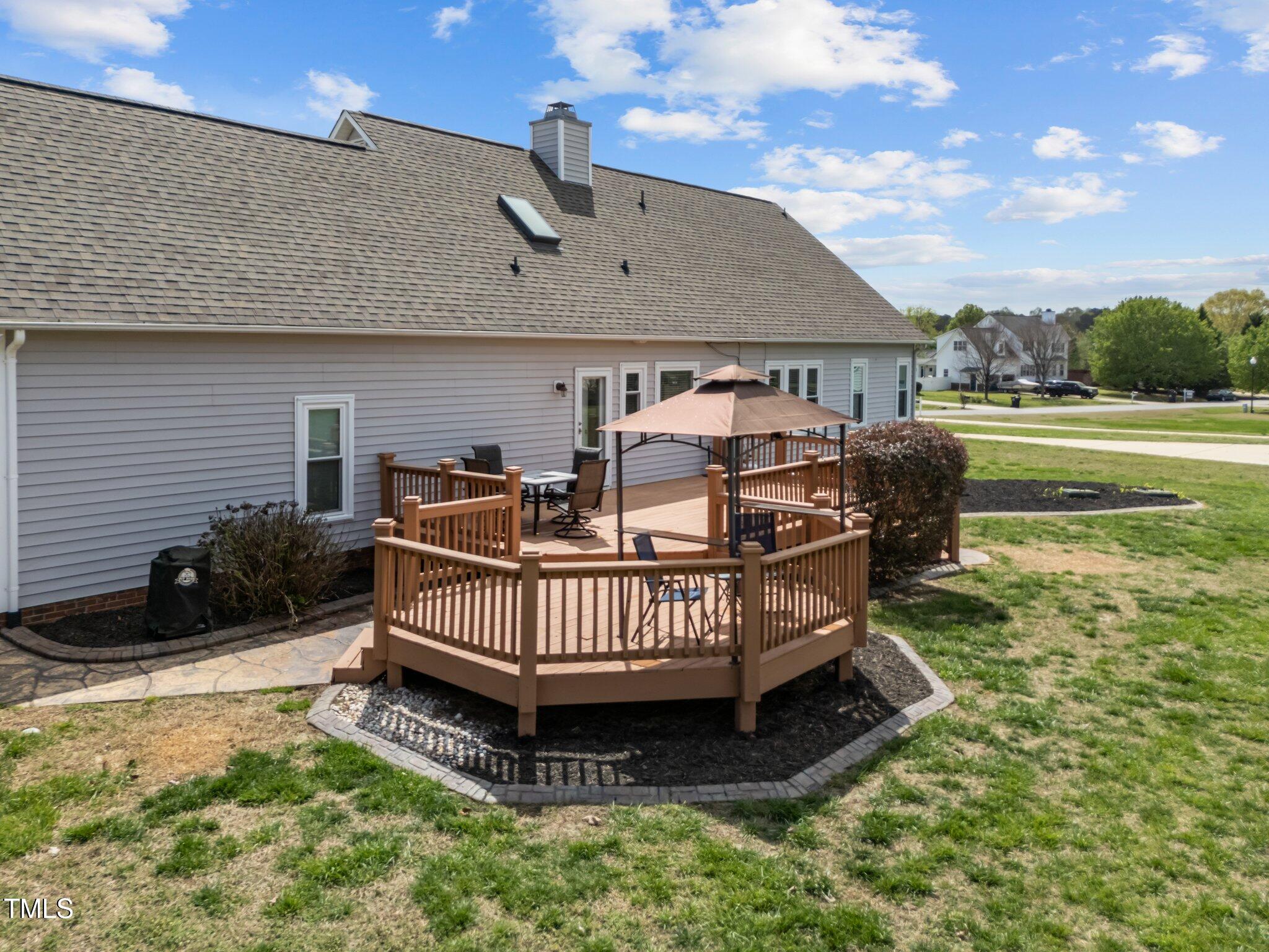 1408 Harvey Johnson Road Raleigh, NC 27603 - Photo 39 of 48 a view of a house with a yard and sitting area