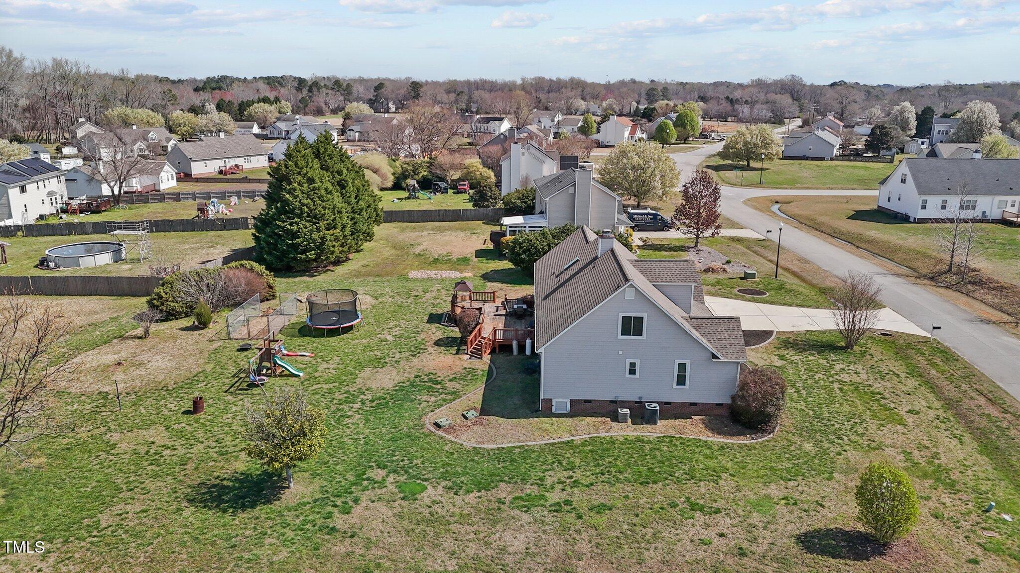 1408 Harvey Johnson Road Raleigh, NC 27603 - Photo 43 of 48 an aerial view of a house with a yard and lake view