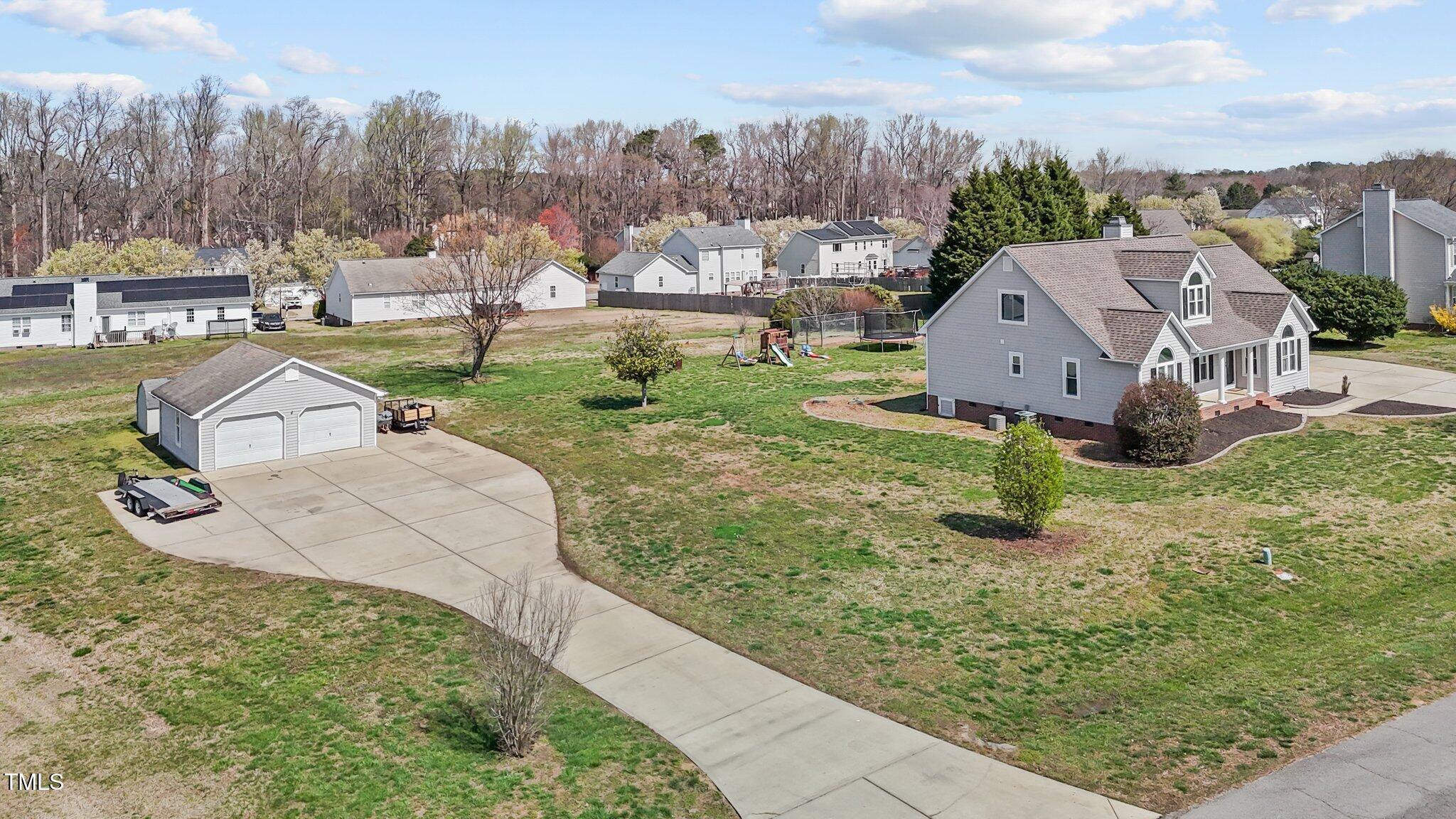 1408 Harvey Johnson Road Raleigh, NC 27603 - Photo 45 of 48 a view of a garden with a houses
