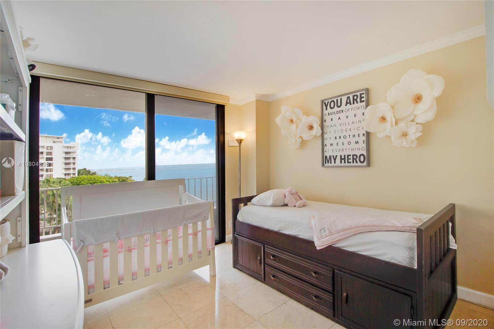 200 Southeast 15th Road, Unit 6D Miami, FL 33129 - Photo 13 of 20 a bedroom with a bed and a large window