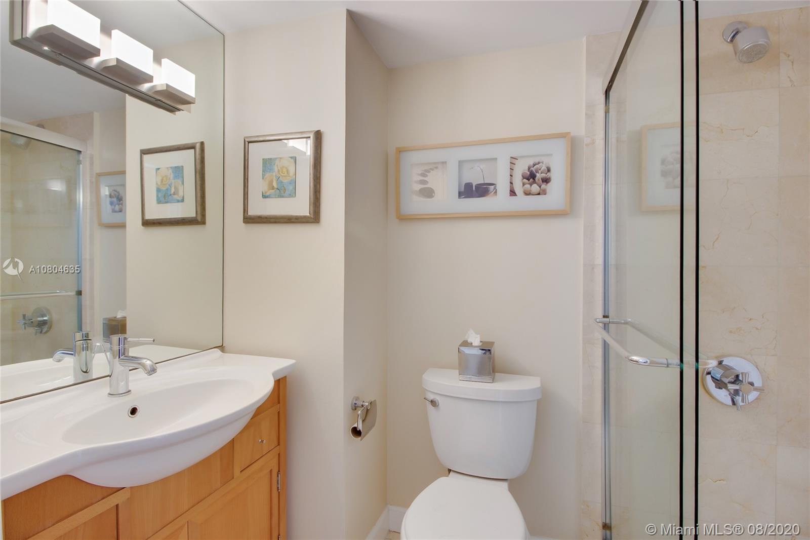 200 Southeast 15th Road, Unit 6D Miami, FL 33129 - Photo 14 of 20 a bathroom with a sink toilet and shower