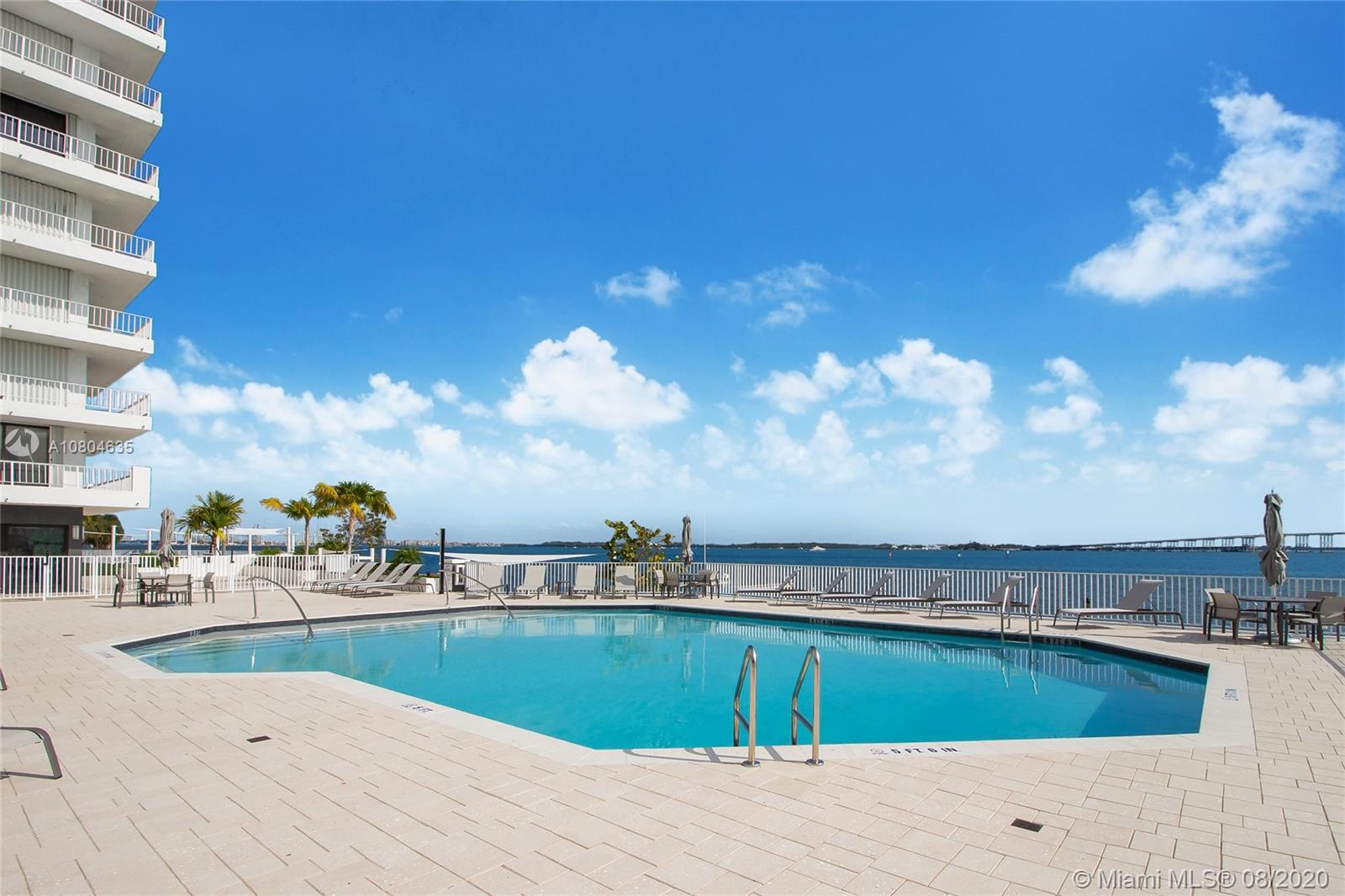 200 Southeast 15th Road, Unit 6D Miami, FL 33129 - Photo 17 of 20 a view of a swimming pool with an ocean view