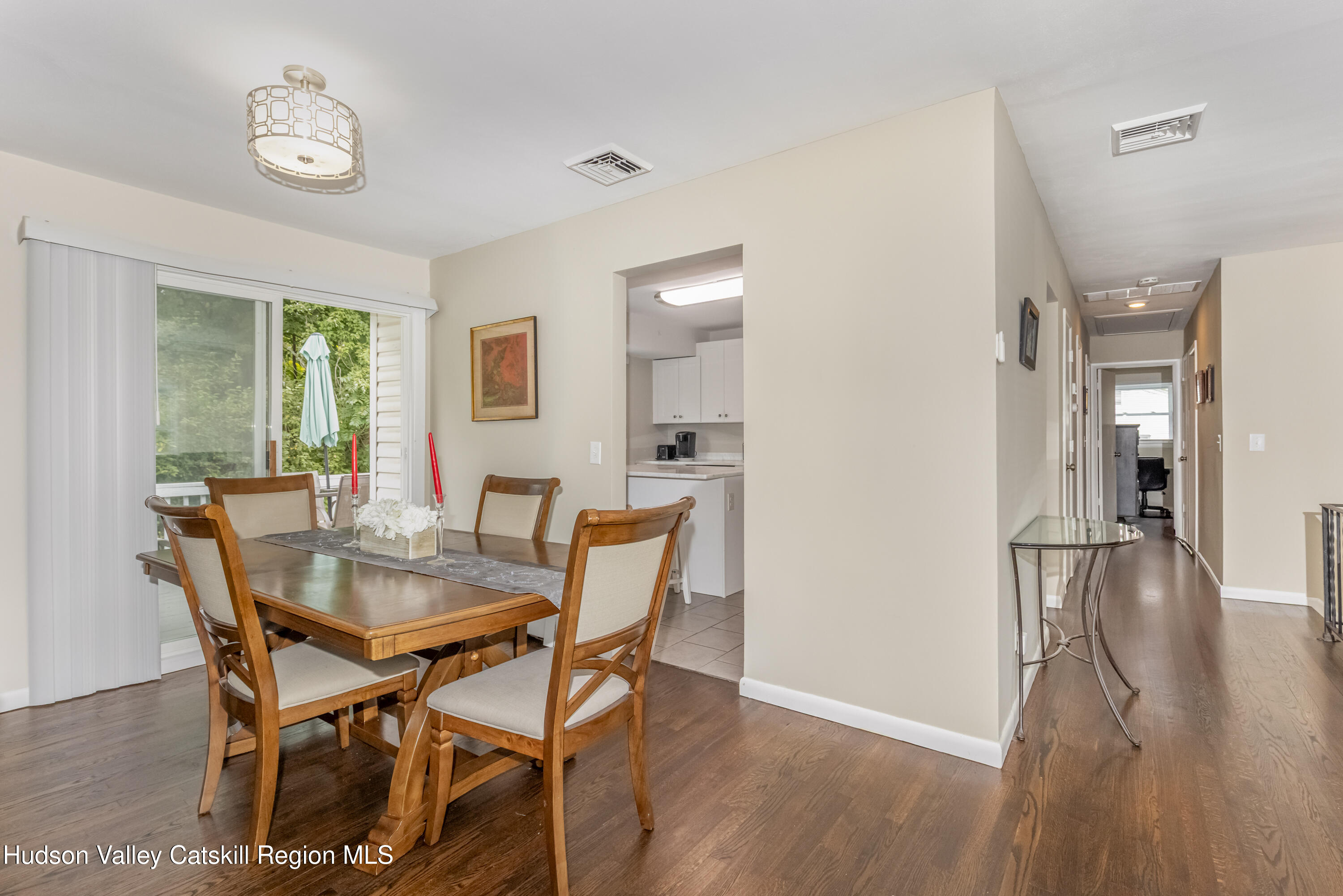 67 Cardinal Drive Poughkeepsie, NY 12601 - Photo 12 of 31 a view of a dining room with furniture and wooden floor