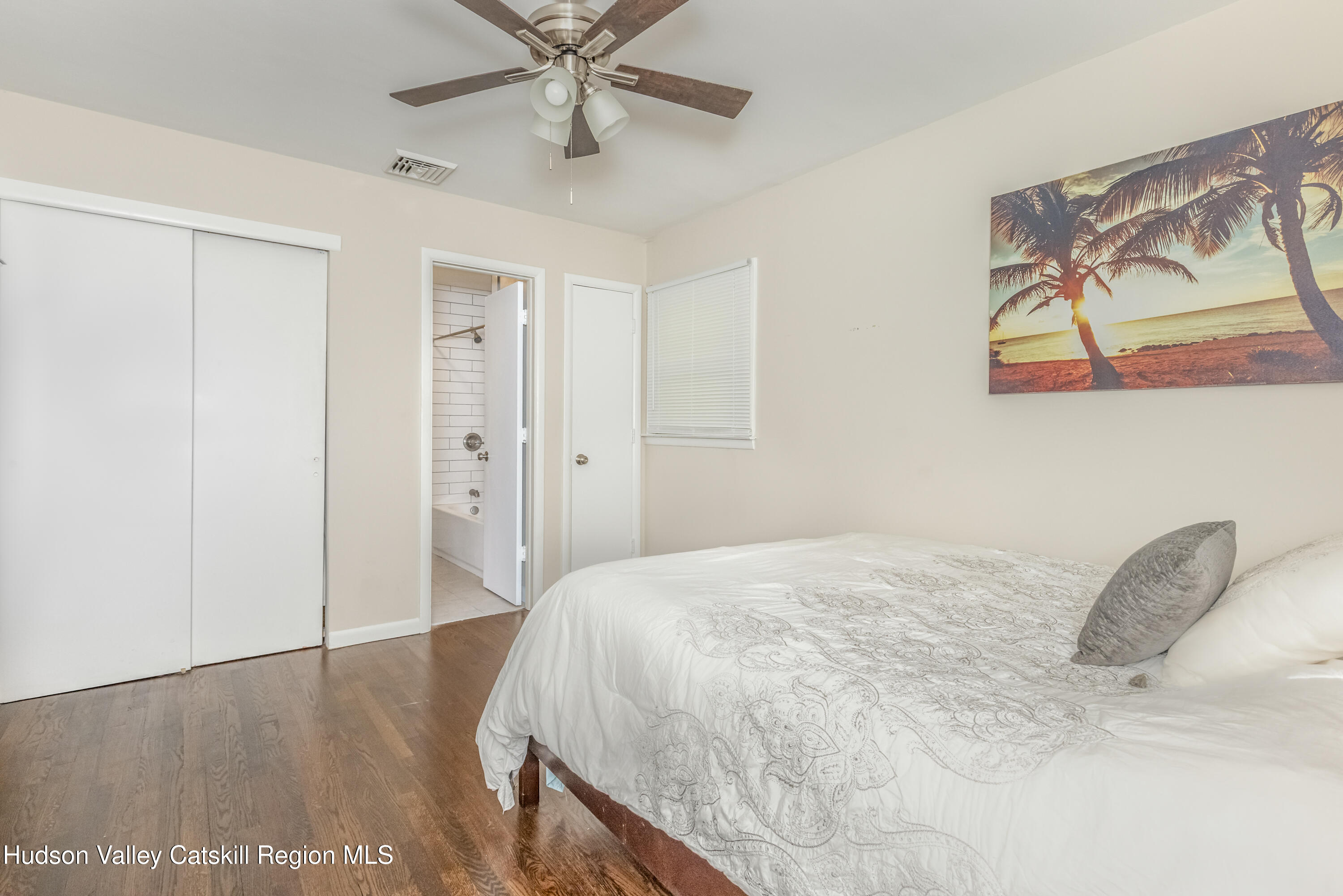 67 Cardinal Drive Poughkeepsie, NY 12601 - Photo 16 of 31 a bedroom with a bed and a painting on the wall