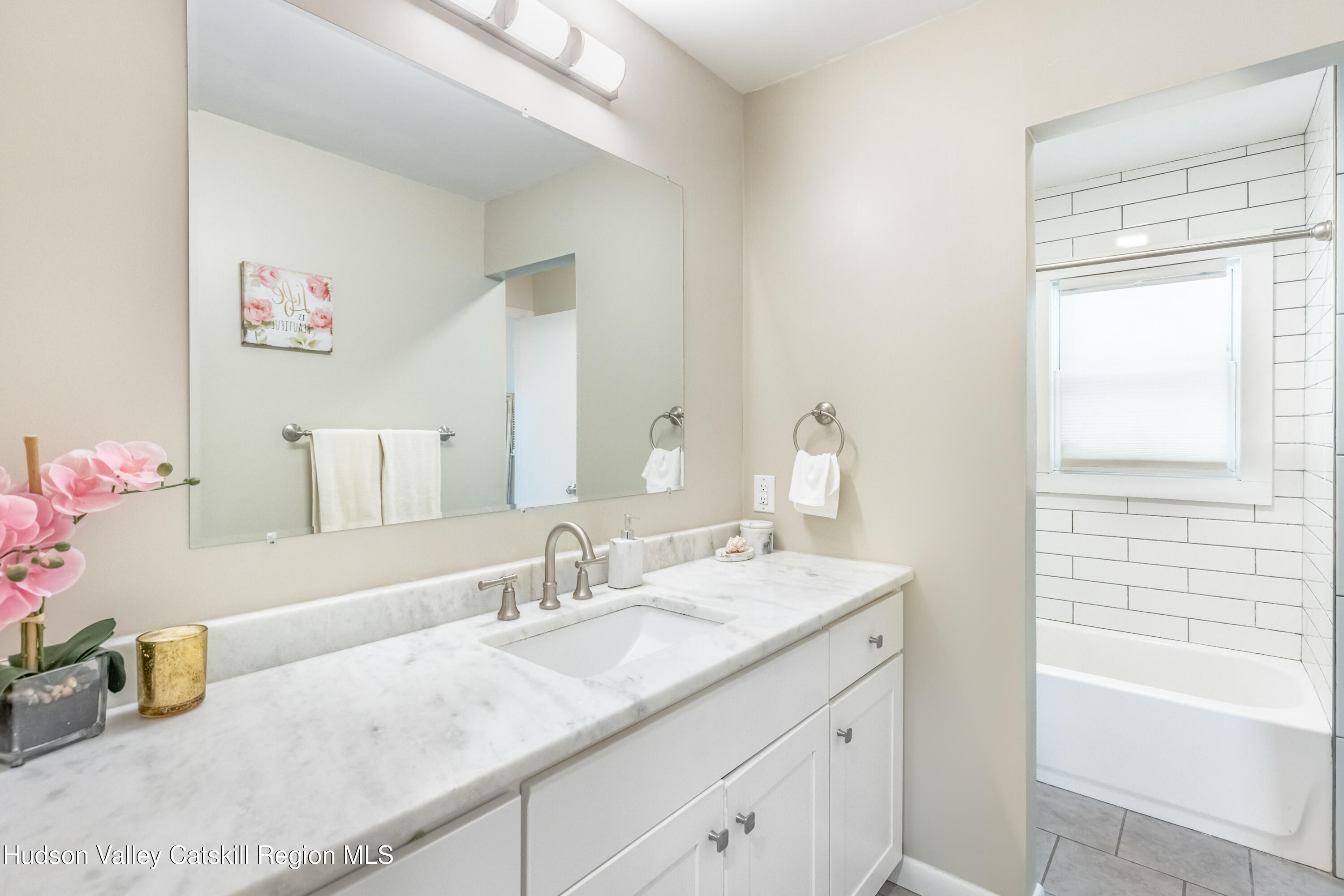 67 Cardinal Drive Poughkeepsie, NY 12601 - Photo 17 of 31 a bathroom with a granite countertop sink and a mirror