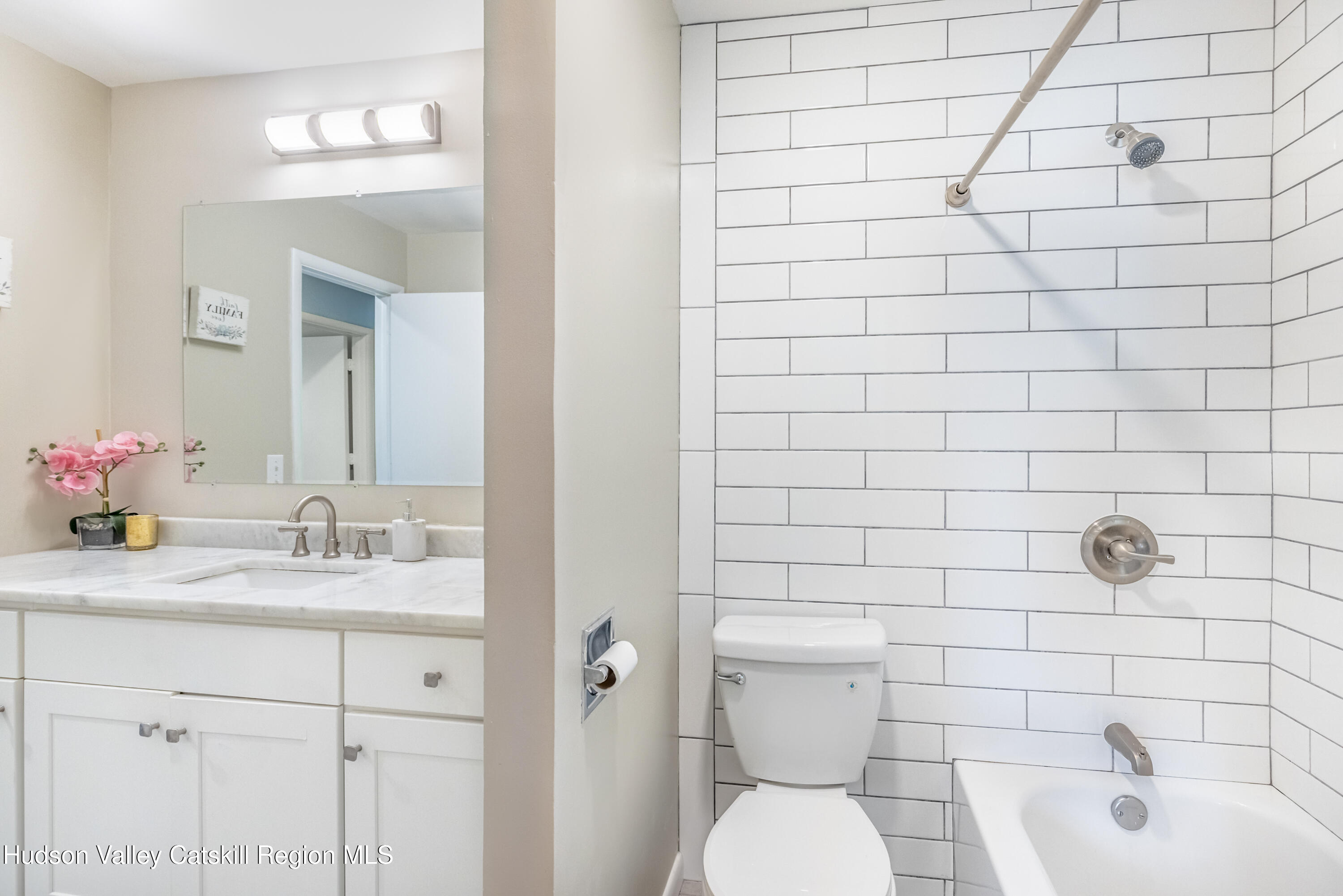 67 Cardinal Drive Poughkeepsie, NY 12601 - Photo 18 of 31 a bathroom with a sink and a mirror