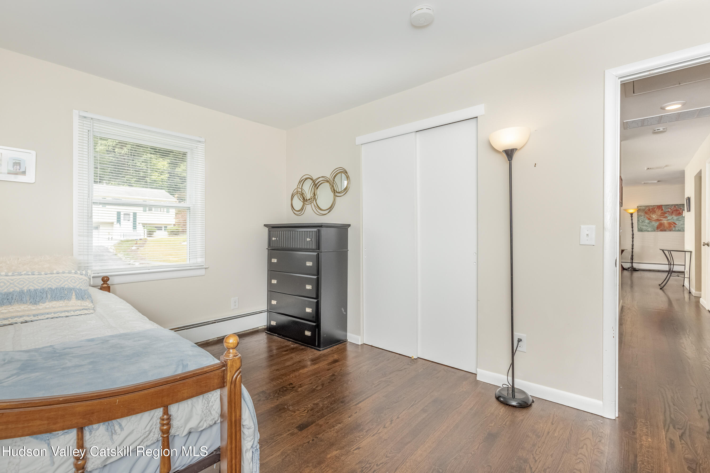 67 Cardinal Drive Poughkeepsie, NY 12601 - Photo 20 of 31 a view of a bedroom with furniture and wooden floor