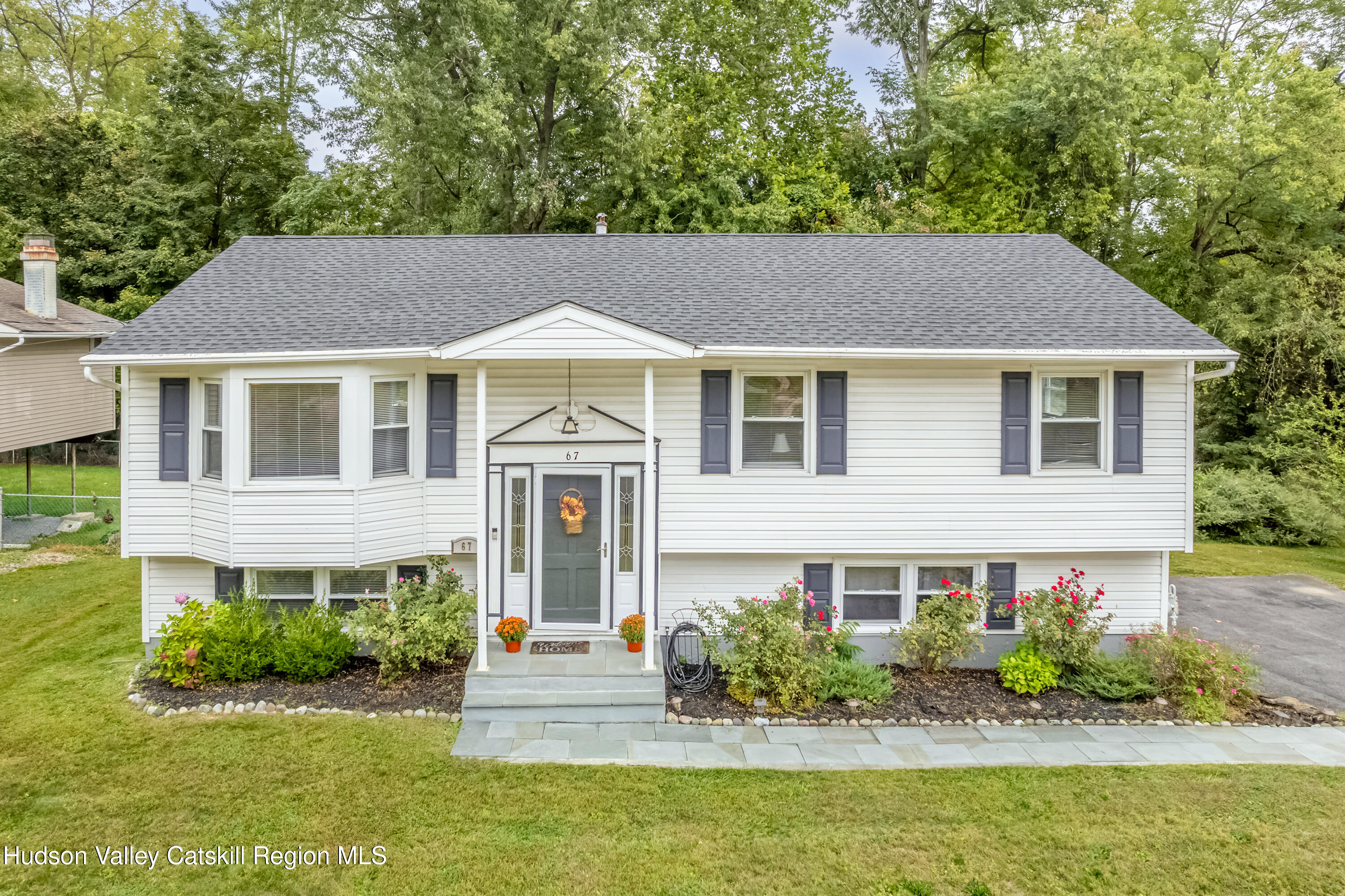 67 Cardinal Drive Poughkeepsie, NY 12601 - Photo 2 of 31 a front view of a house with a yard