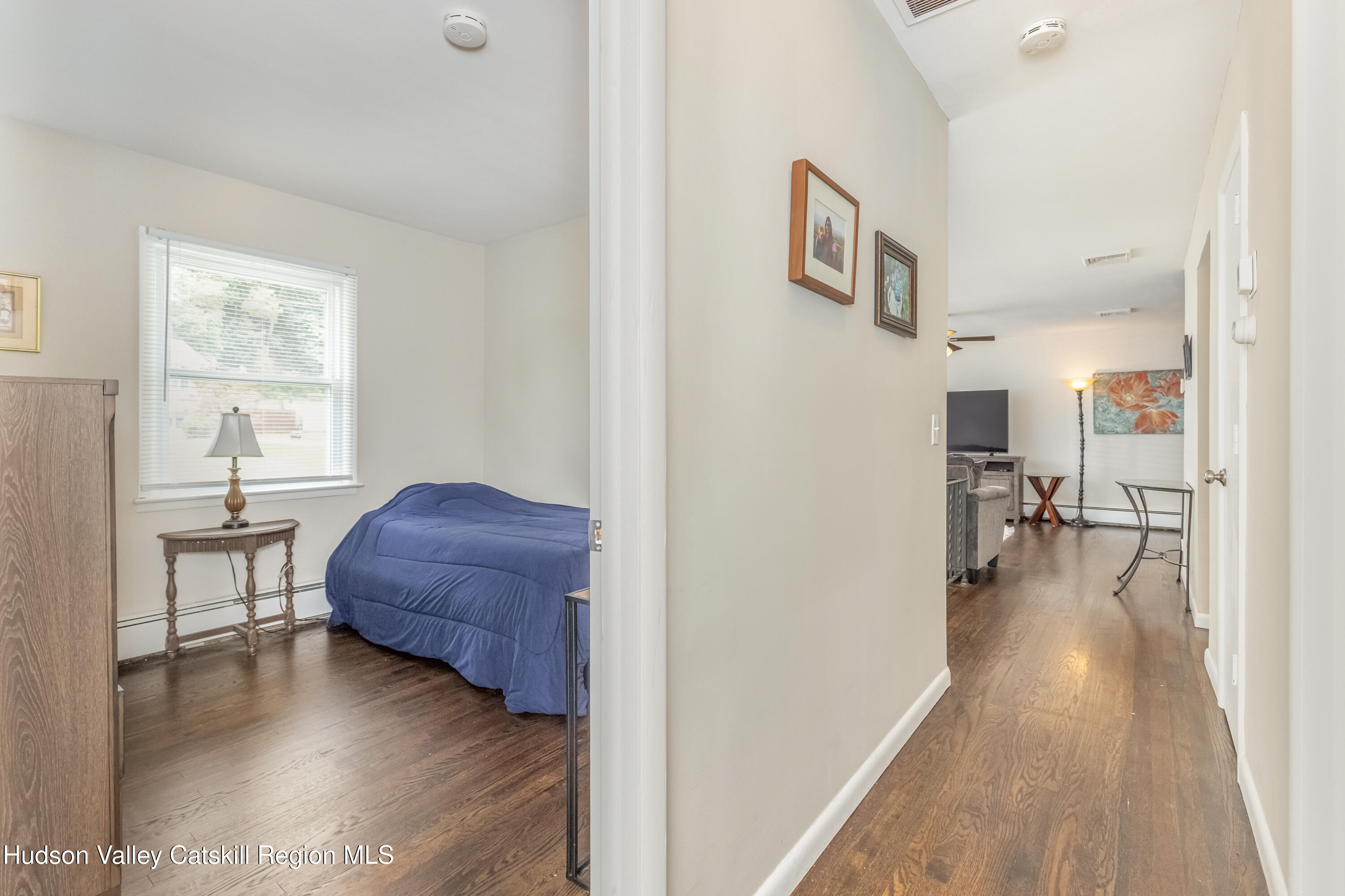 67 Cardinal Drive Poughkeepsie, NY 12601 - Photo 21 of 31 a living room with furniture and a wooden floor