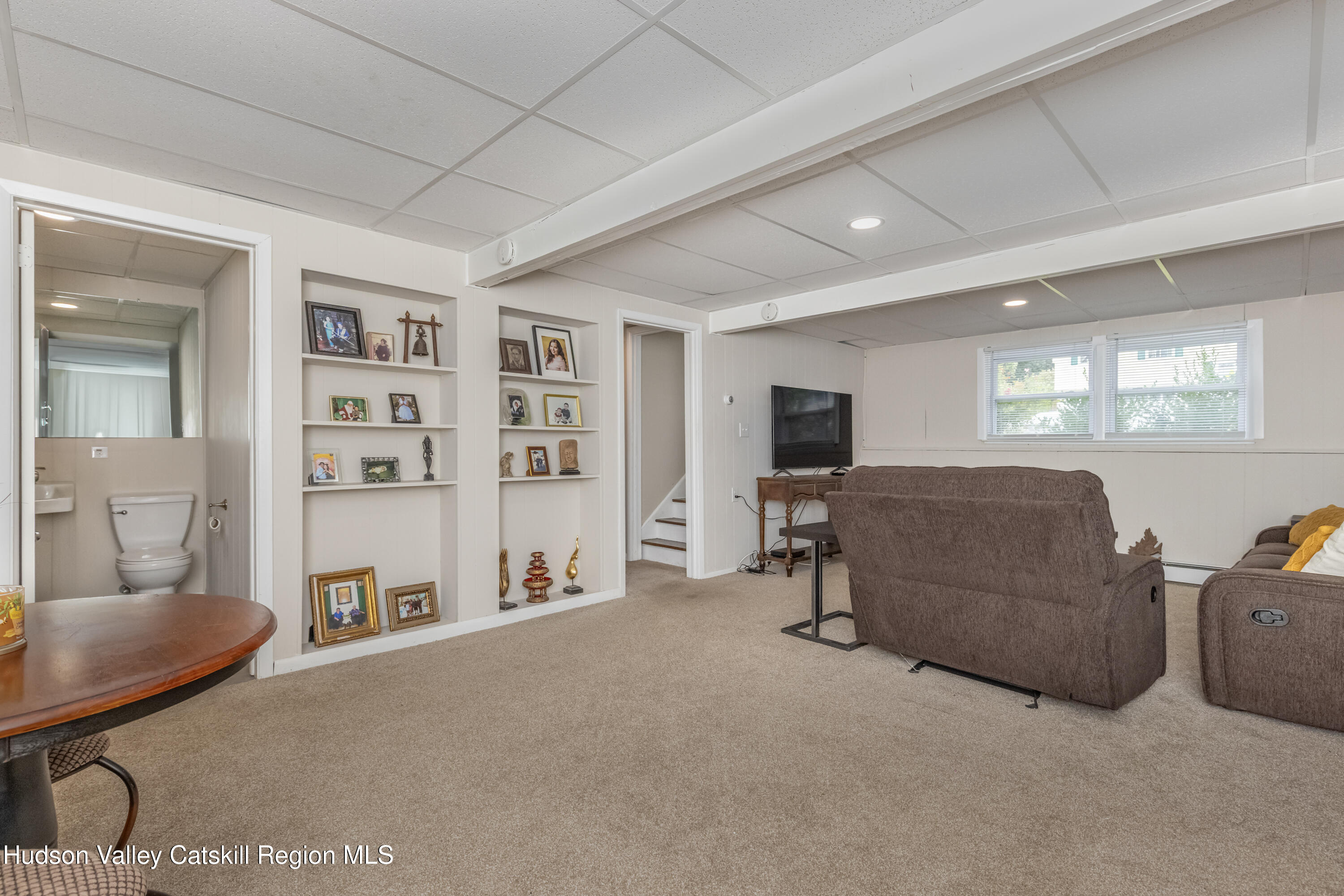 67 Cardinal Drive Poughkeepsie, NY 12601 - Photo 27 of 31 a living room with furniture and a flat screen tv