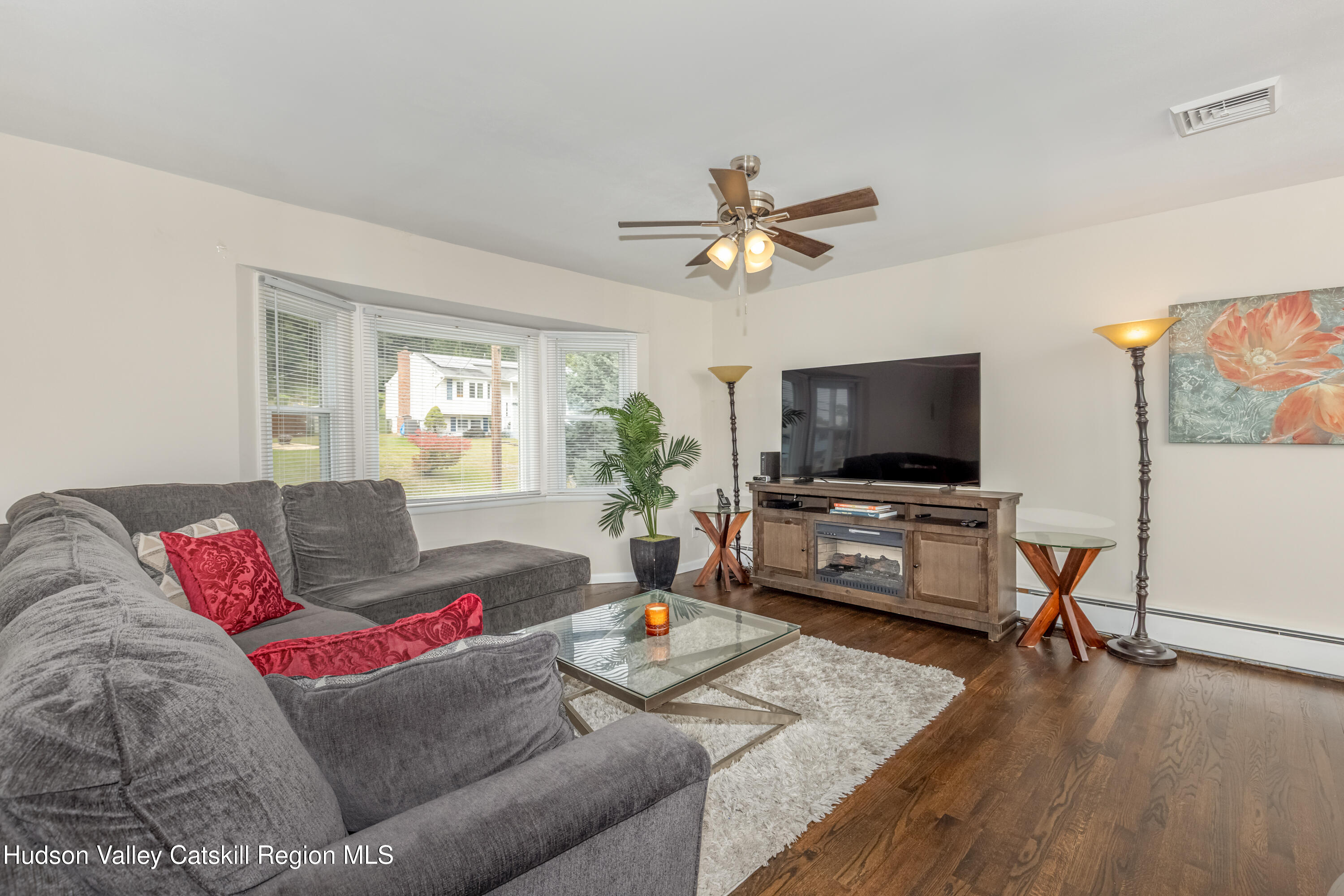 67 Cardinal Drive Poughkeepsie, NY 12601 - Photo 4 of 31 a living room with furniture and a flat screen tv