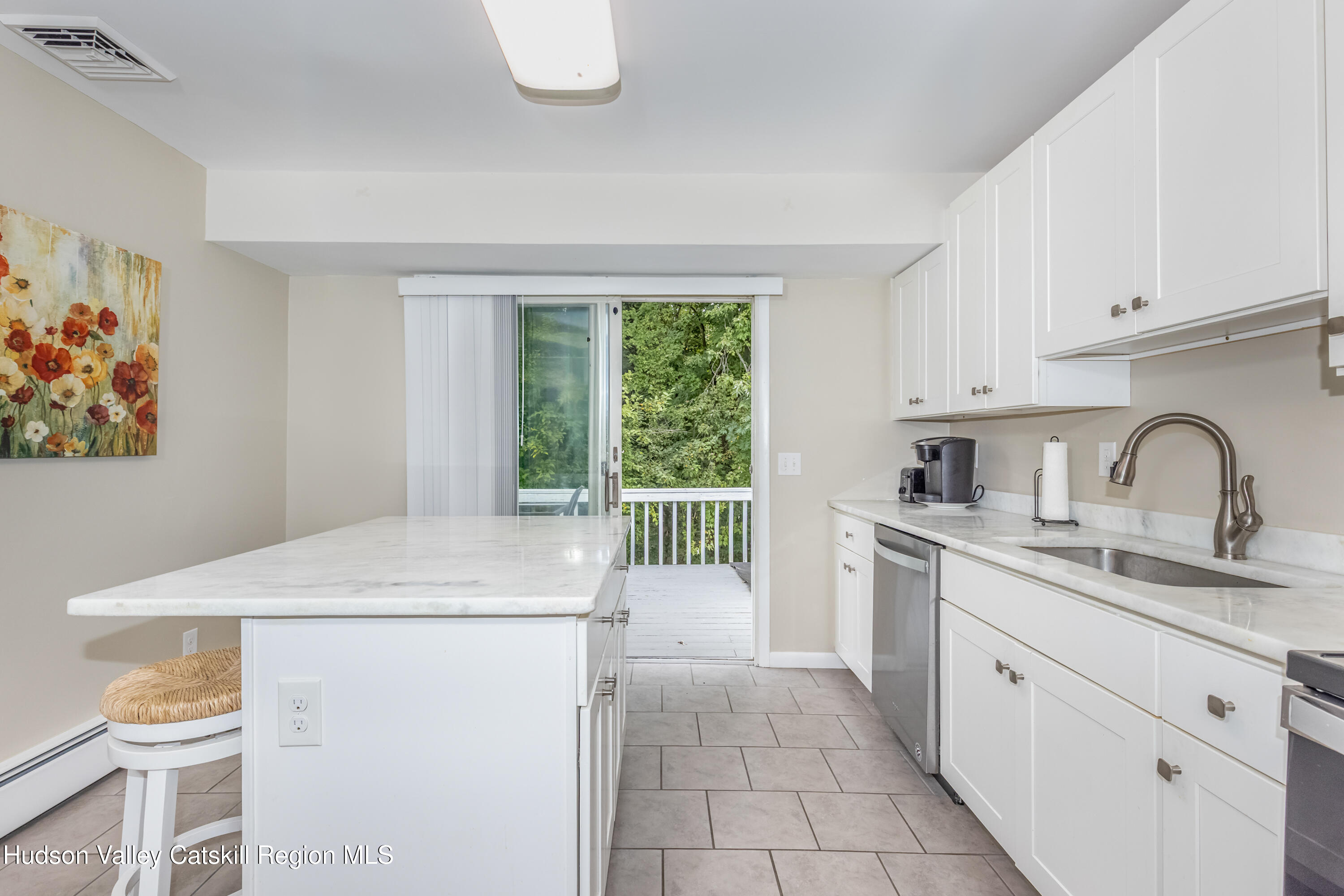 67 Cardinal Drive Poughkeepsie, NY 12601 - Photo 8 of 31 a kitchen with a sink cabinets and a stove top oven