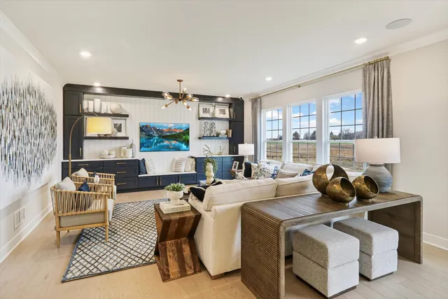 a living room with furniture rug and window