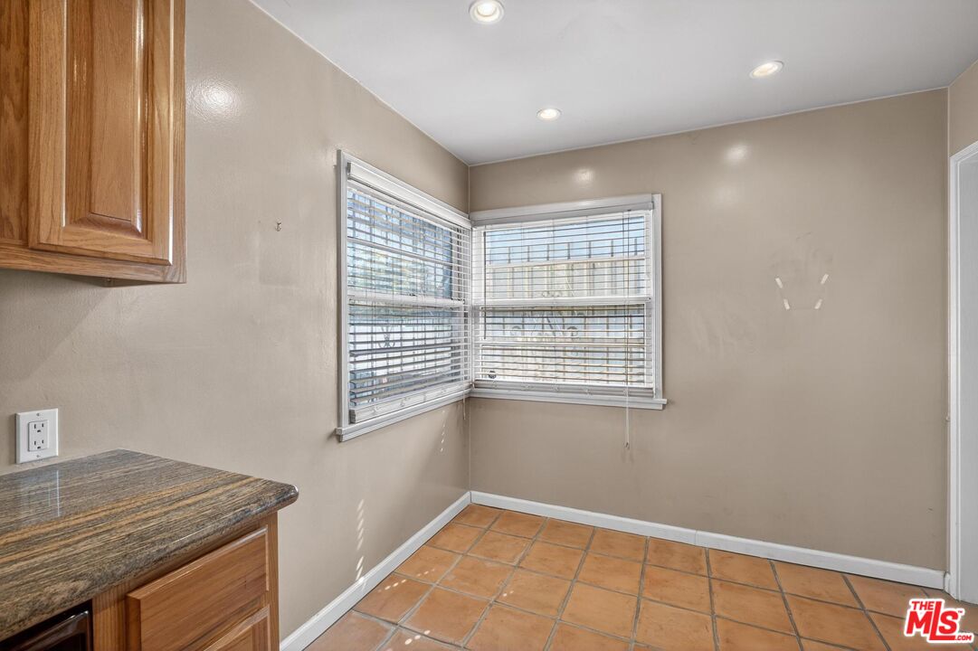 3692 Buckingham Road Los Angeles, CA 90016 - Photo 18 of 40 a view of an empty room with a window