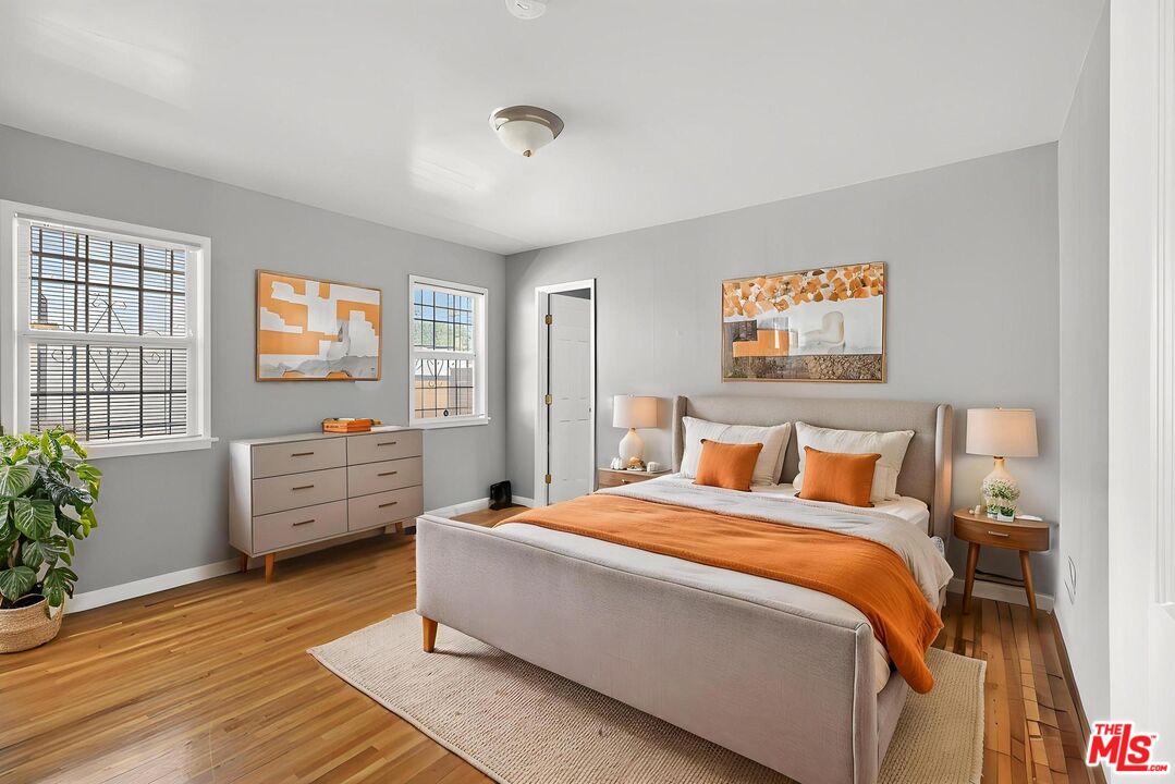 3692 Buckingham Road Los Angeles, CA 90016 - Photo 26 of 40 a bed room with a bed and a couch