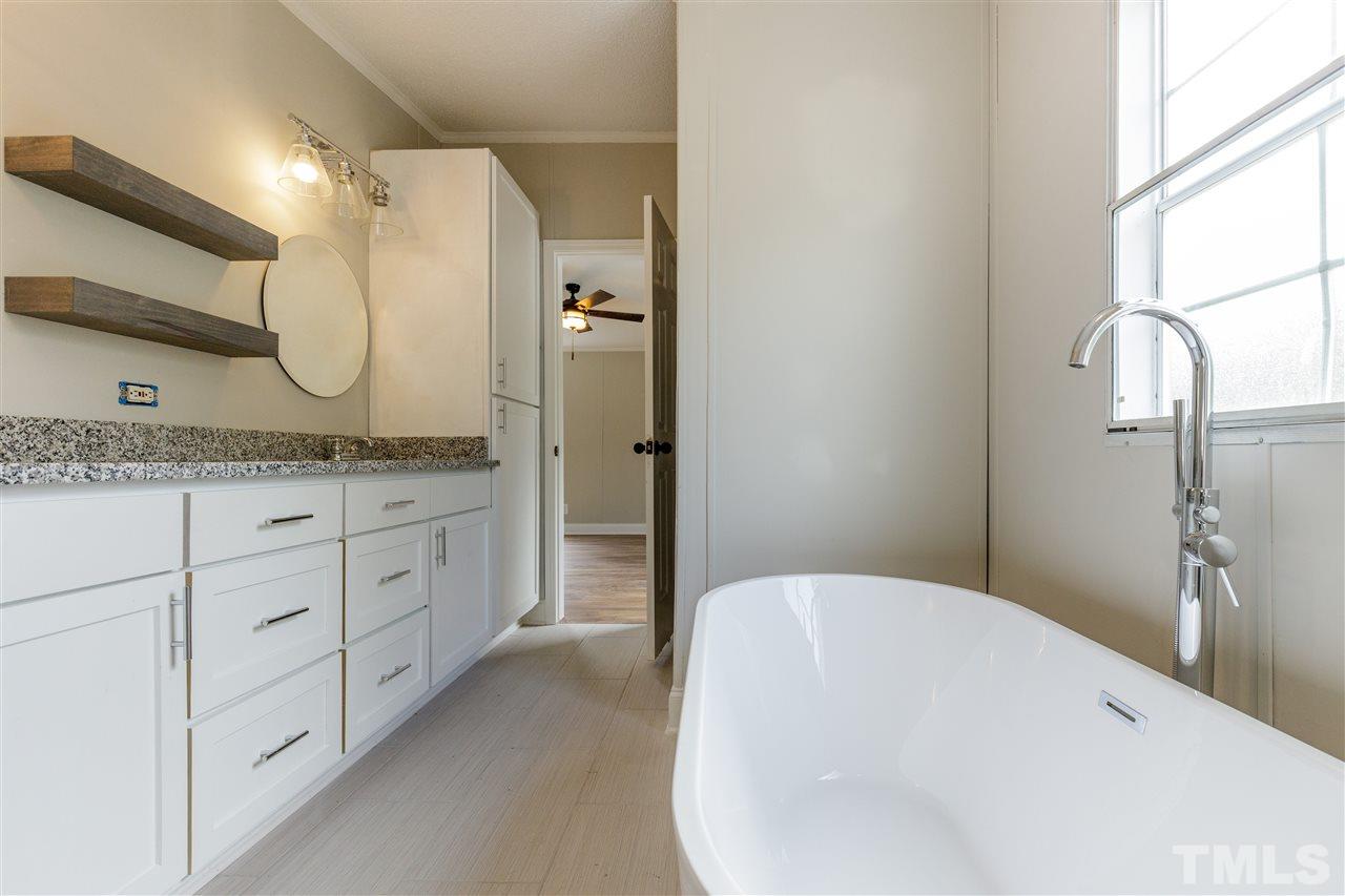 2162 Eldridge Road Newton Grove, NC 28366 - Photo 11 of 22 Gorgeous stand alone tub completes this full master bathroom with style!