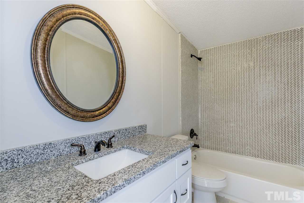 2162 Eldridge Road Newton Grove, NC 28366 - Photo 13 of 22 Hall bathroom