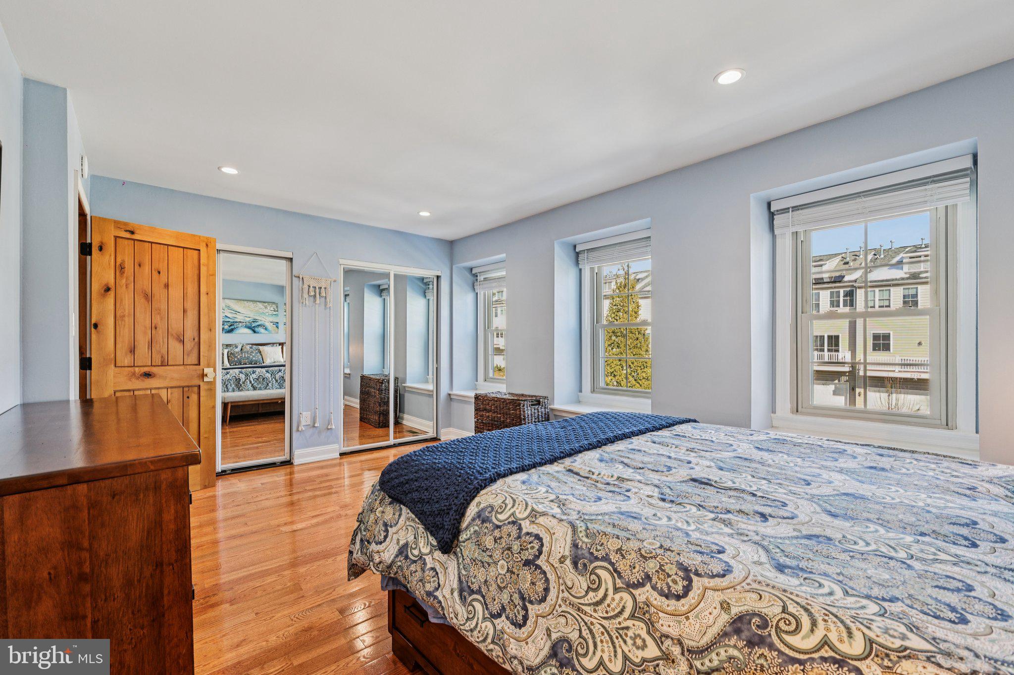 10616 Pennydog Lane Silver Spring, MD 20902 - Photo 19 of 58 a bedroom with a bed and wooden floor