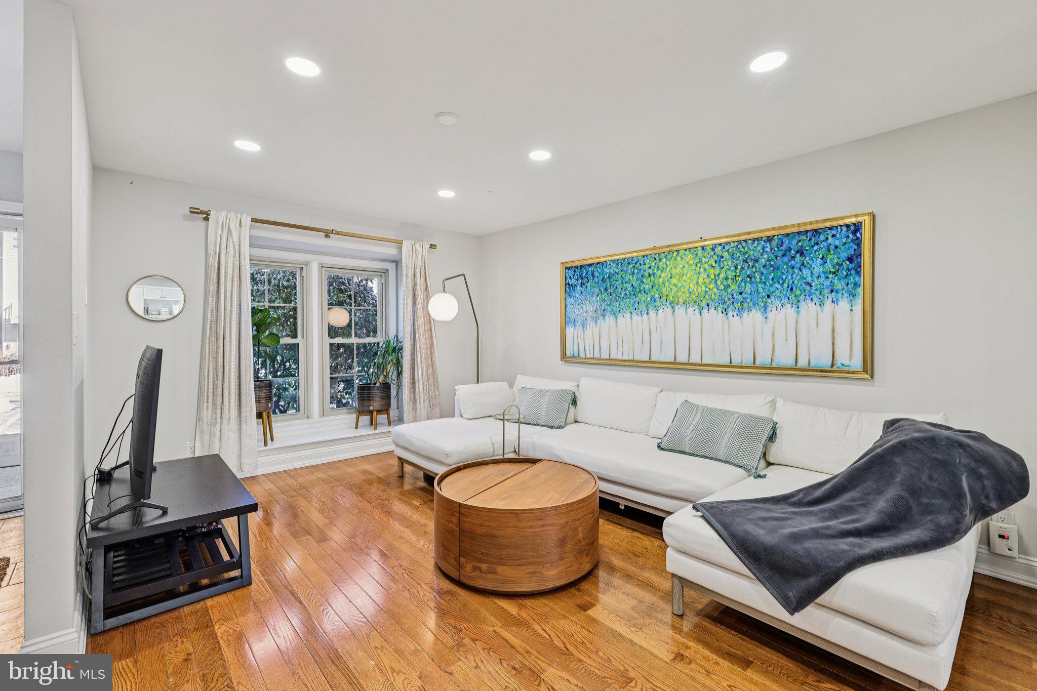 10616 Pennydog Lane Silver Spring, MD 20902 - Photo 2 of 58 a living room with furniture and a flat screen tv