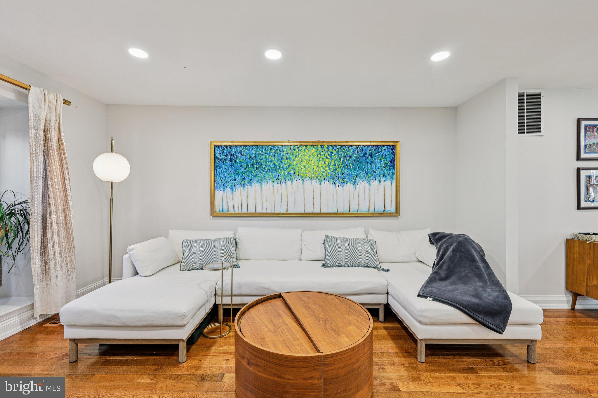 10616 Pennydog Lane Silver Spring, MD 20902 - Photo 3 of 58 a living room with furniture and a wooden floor