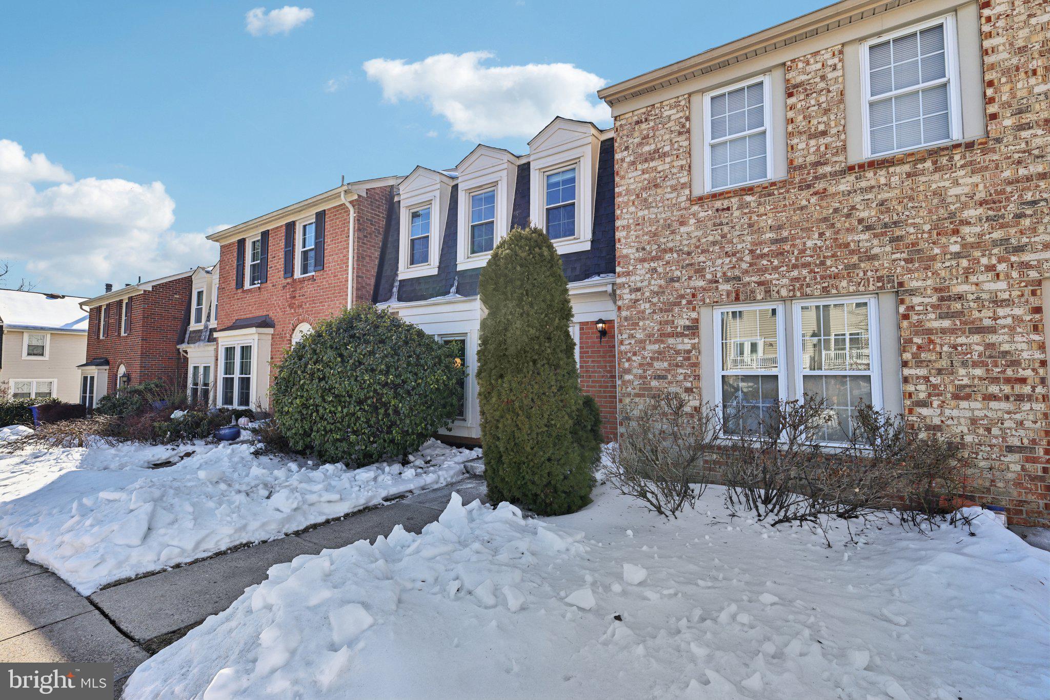 10616 Pennydog Lane Silver Spring, MD 20902 - Photo 39 of 58 a view of a brick house next to a yard