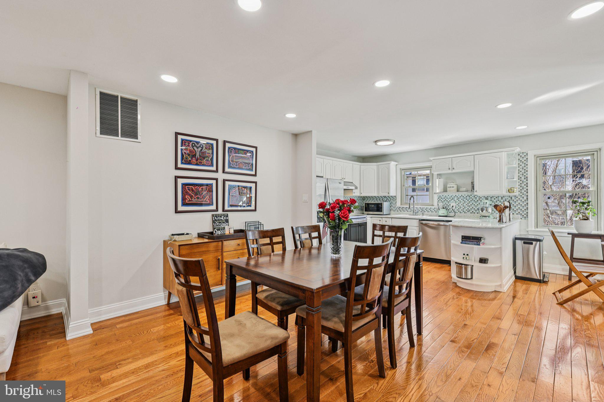 10616 Pennydog Lane Silver Spring, MD 20902 - Photo 6 of 58 a view of a dining room with furniture and wooden floor