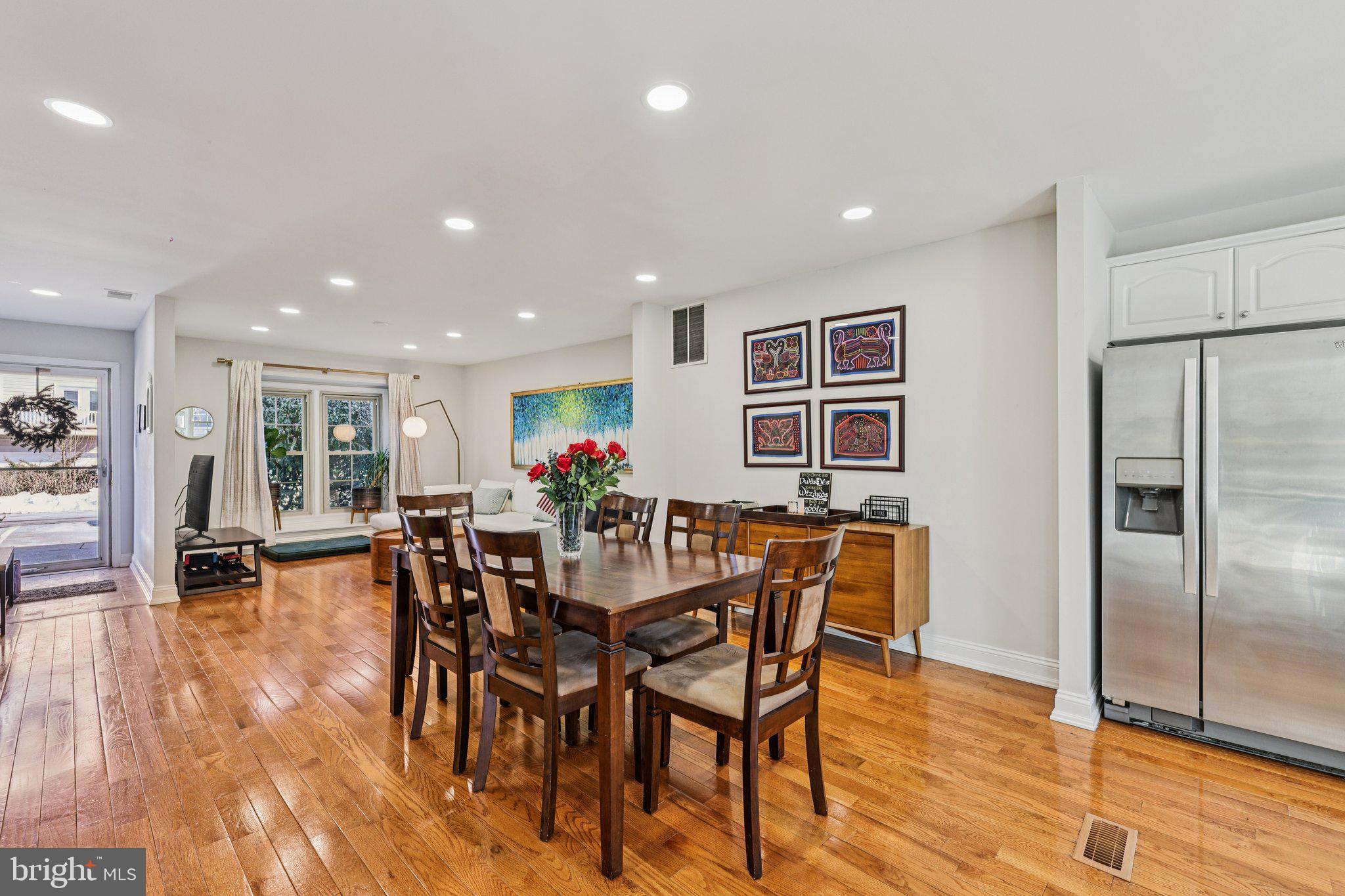 10616 Pennydog Lane Silver Spring, MD 20902 - Photo 7 of 58 a view of a dining room with furniture and wooden floor