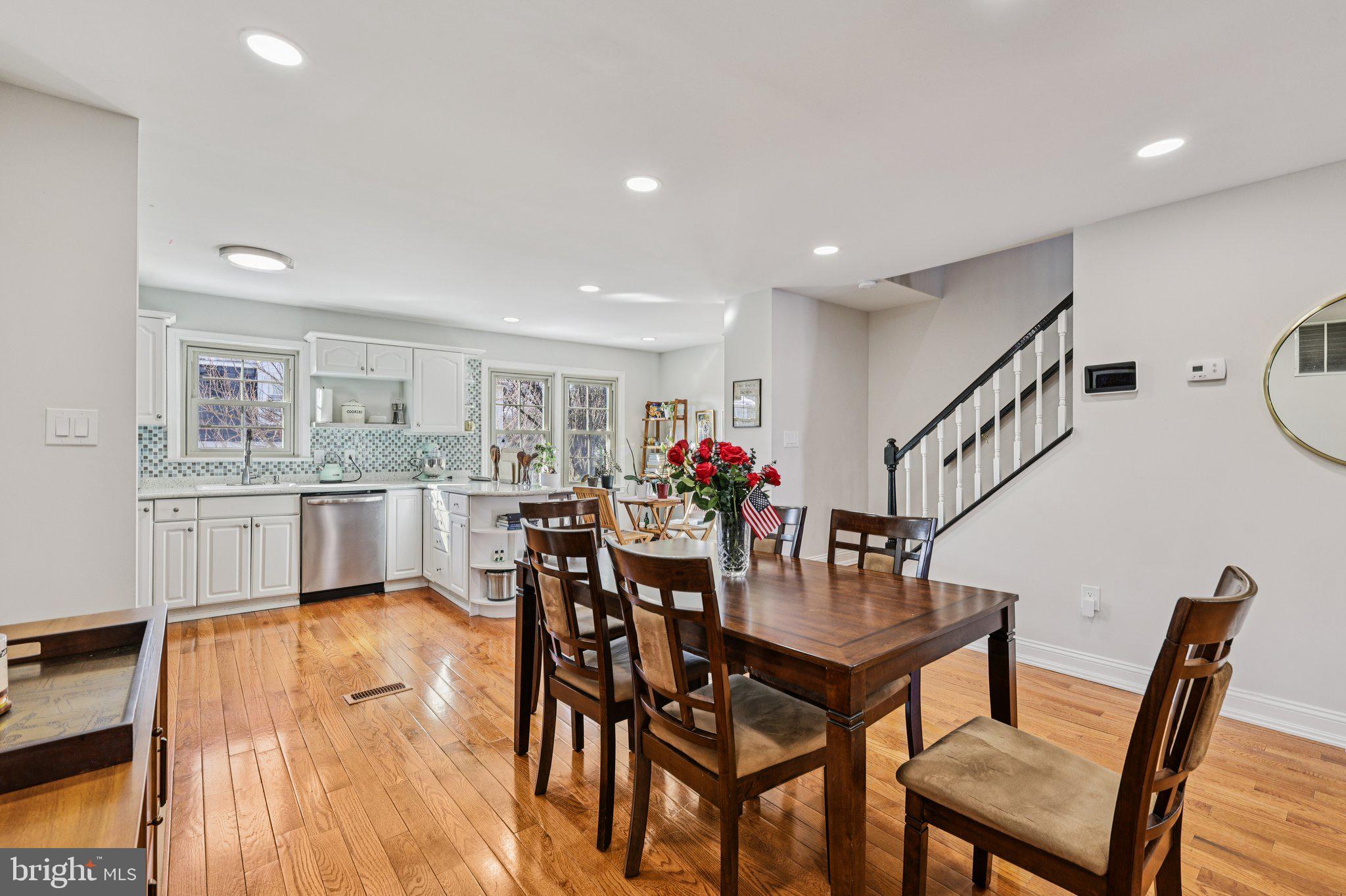 10616 Pennydog Lane Silver Spring, MD 20902 - Photo 8 of 58 a view of a dining room with furniture and wooden floor