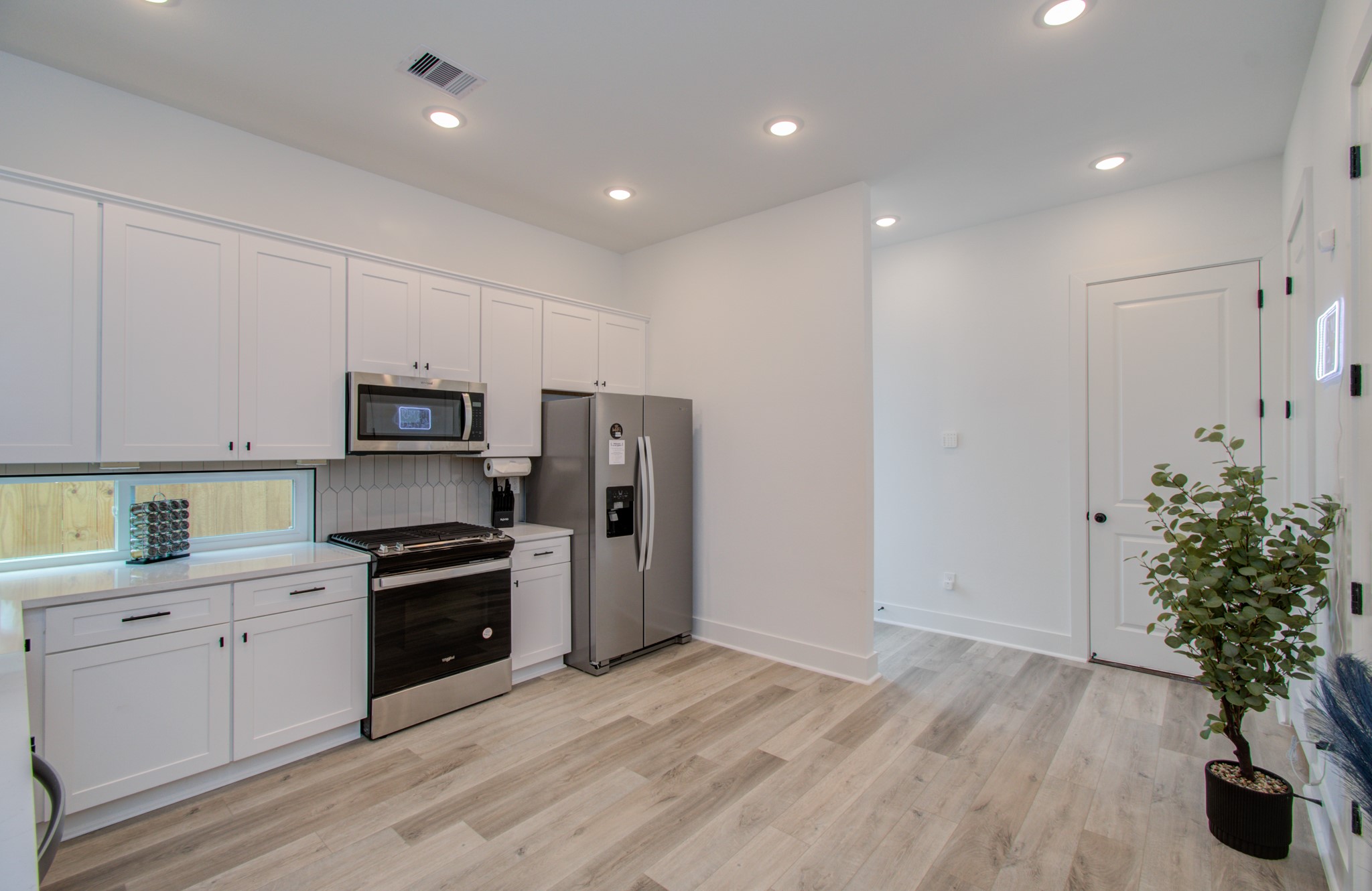 1616 Benson Street Houston, TX 77020 - Photo 14 of 38 a kitchen with stainless steel appliances a refrigerator sink and microwave