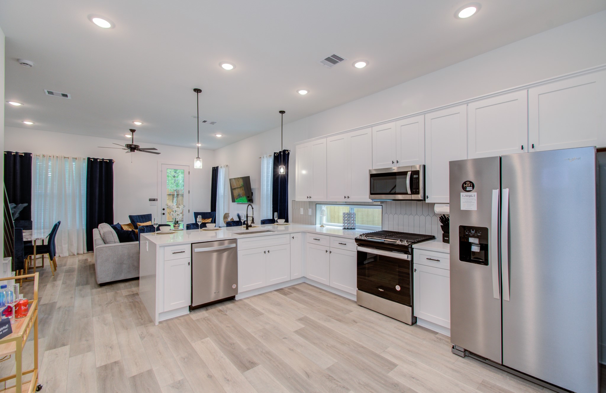 1616 Benson Street Houston, TX 77020 - Photo 15 of 38 a large kitchen with stainless steel appliances lots of counter space sink refrigerator and cabinets