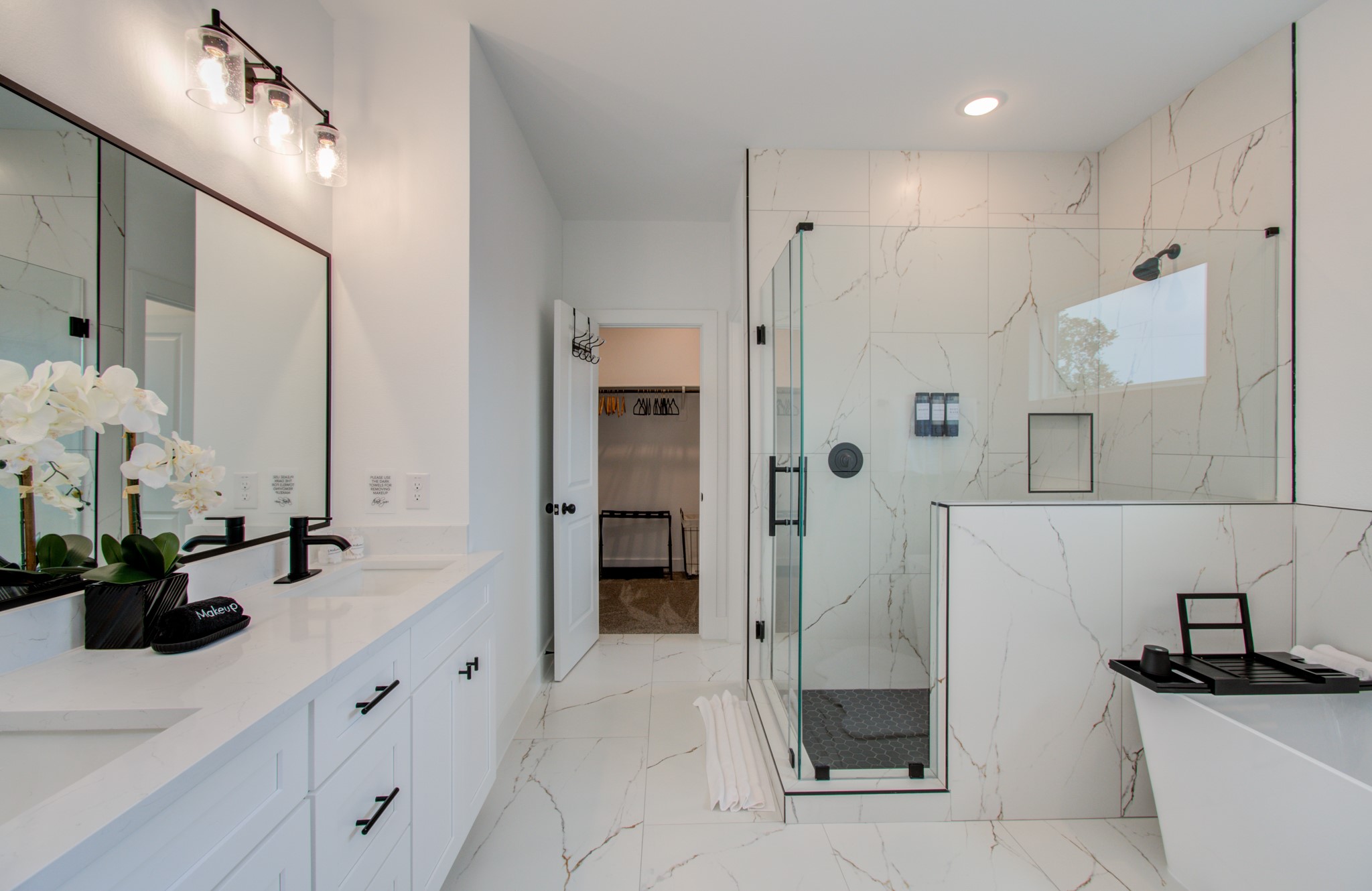 1616 Benson Street Houston, TX 77020 - Photo 20 of 38 a bathroom with a double sink shower and a mirror