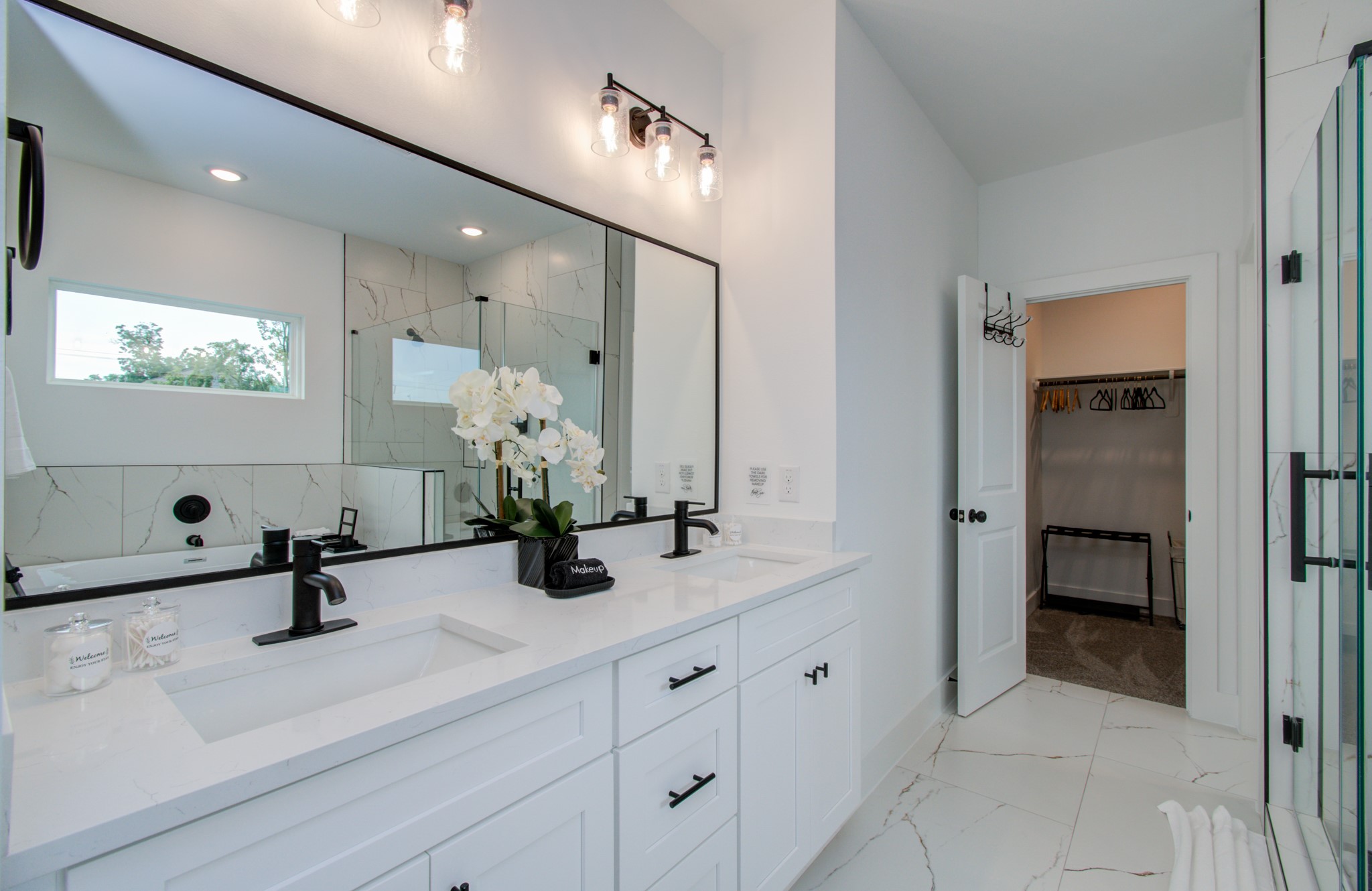 1616 Benson Street Houston, TX 77020 - Photo 21 of 38 a bathroom with double vanity sink a mirror and window