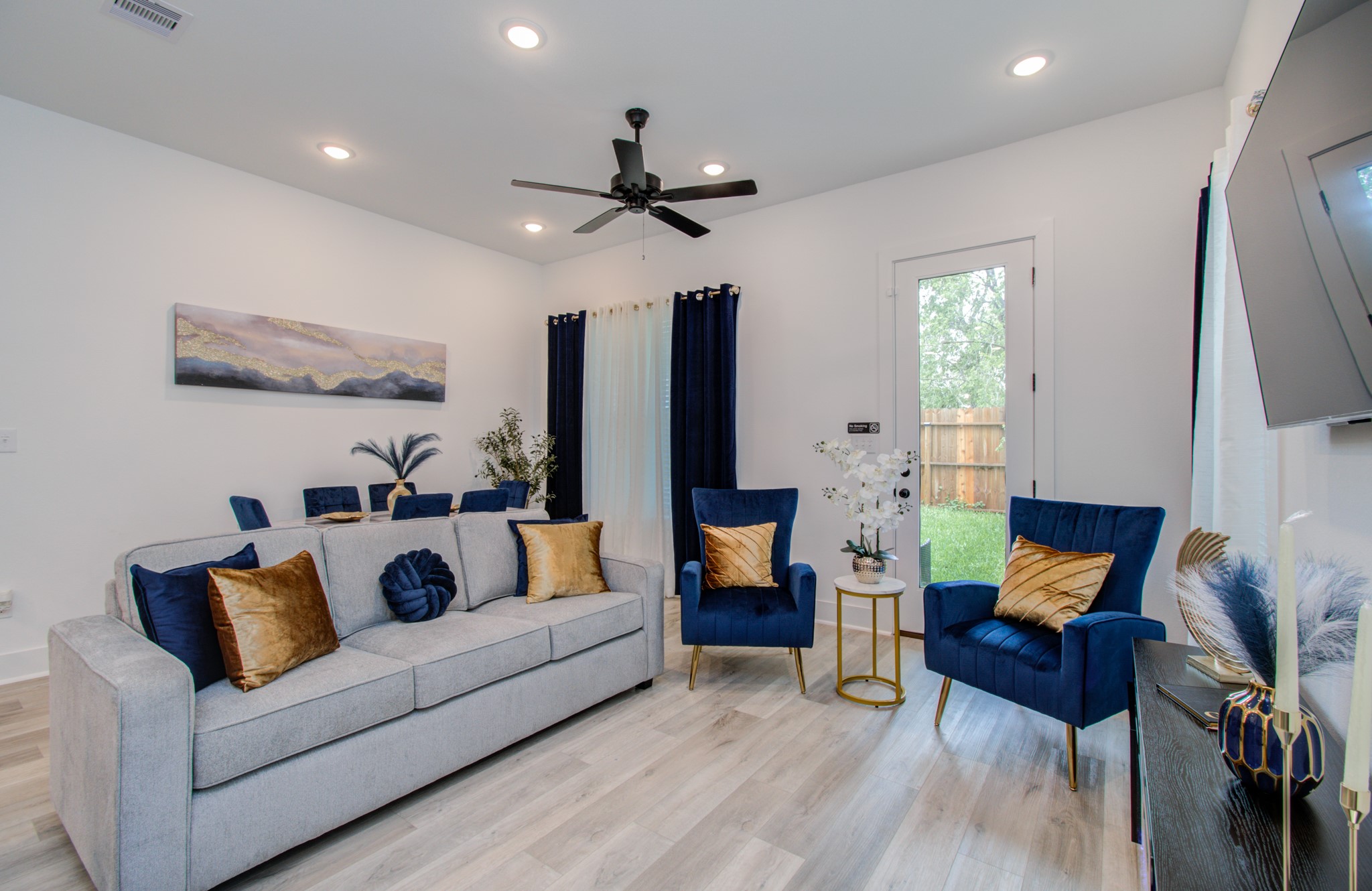 1616 Benson Street Houston, TX 77020 - Photo 10 of 38 a living room with furniture and a flat screen tv